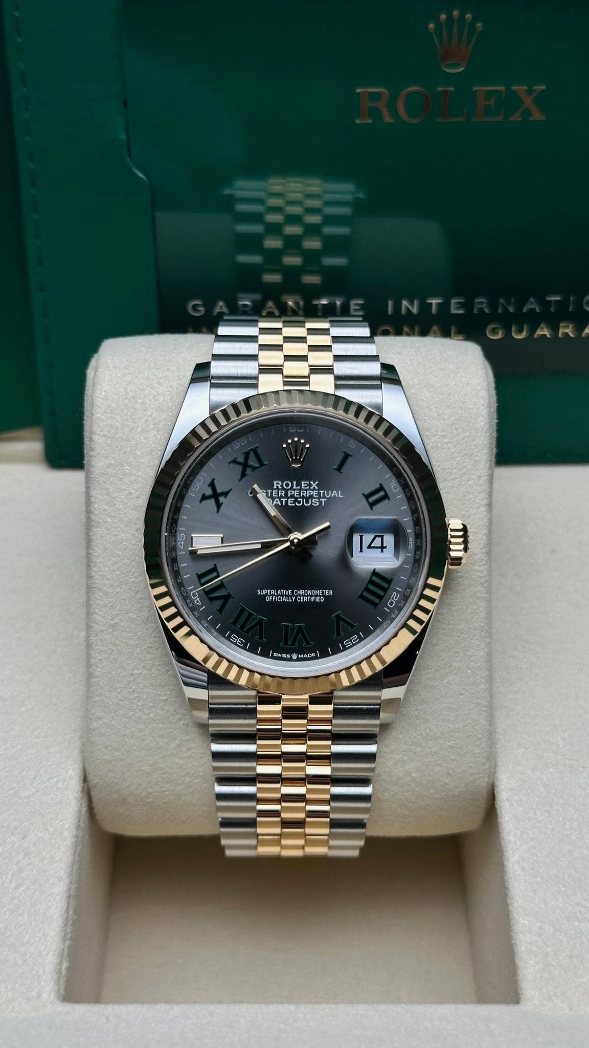 May be an image of wrist watch and text