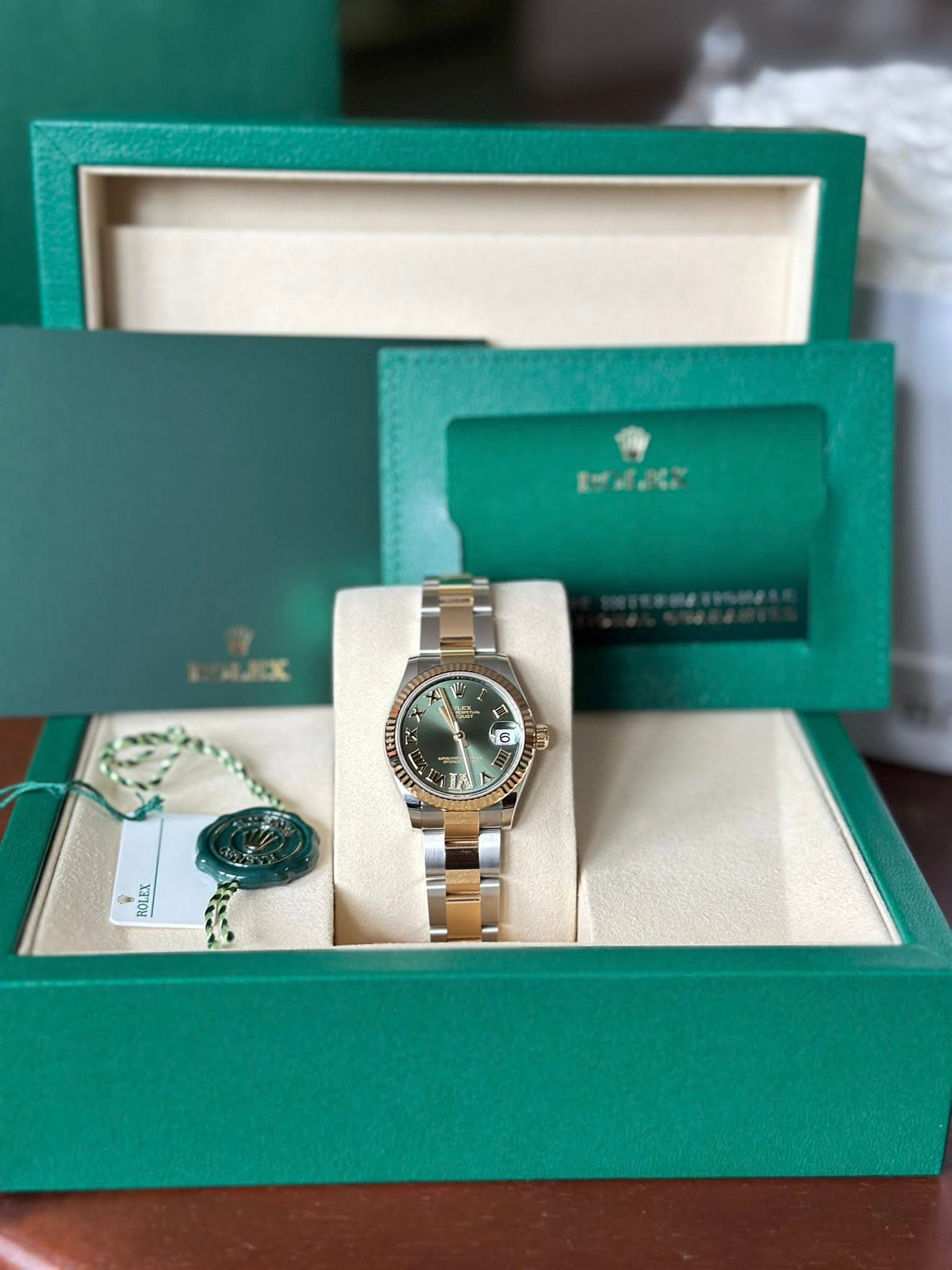 May be an image of wrist watch and text