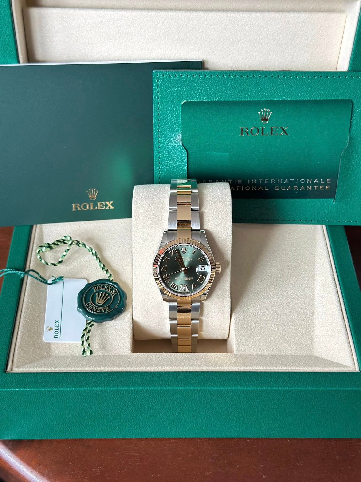 May be an image of wrist watch and text