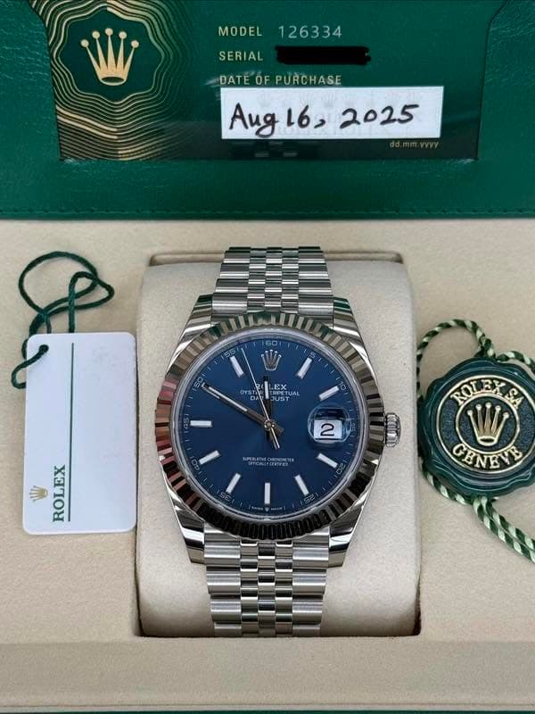 May be an image of wrist watch and text that says 'MODEL 126334 SERIAL DATE OF PURCHASE Aug Aug16, 16, 2025 E IN 60 50 ONST +ስ LEX ERPE RPLIL UAL JUS JUST 10 ک 2 ROLEXSA SA ROL…