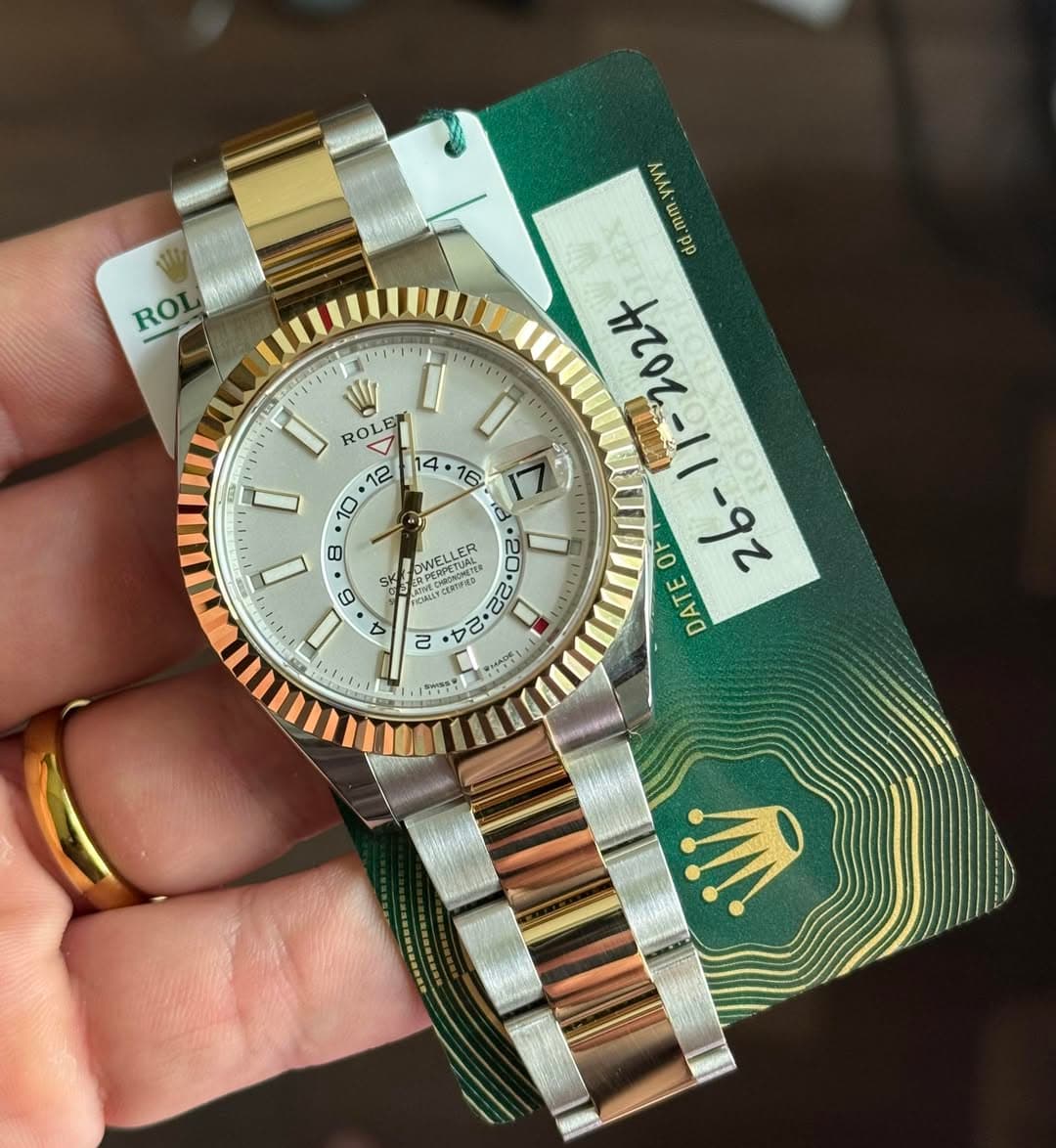 May be an image of wrist watch and text
