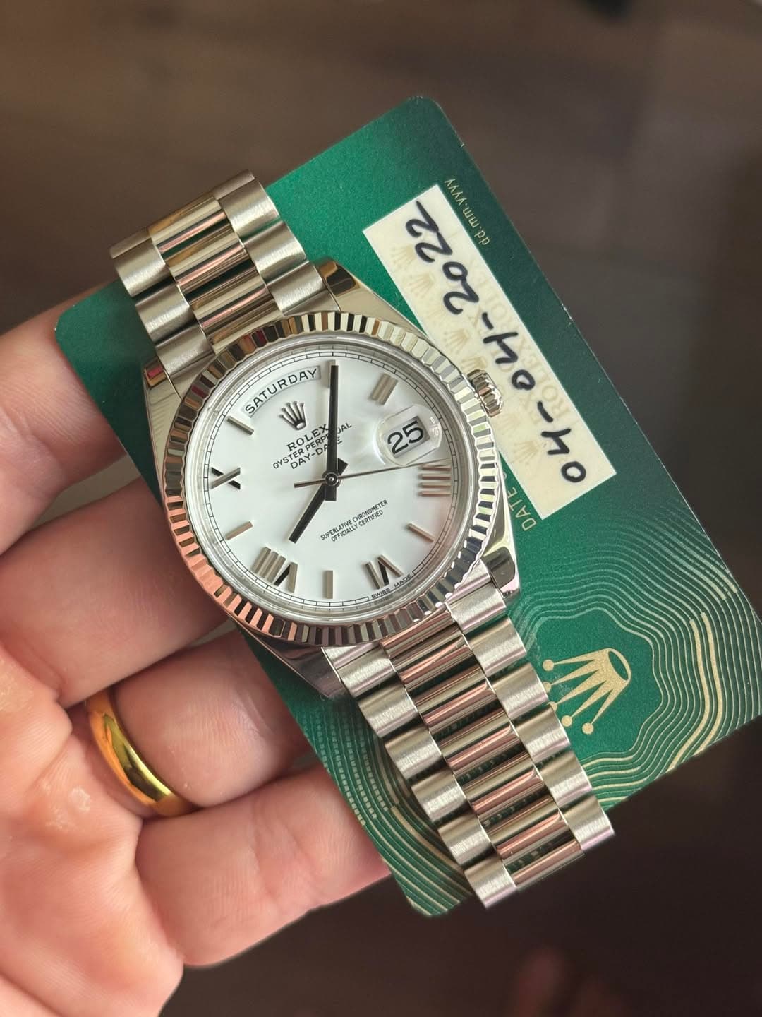 May be an image of wrist watch and text