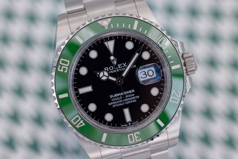 May be an image of wrist watch and text that says 'חסו, 50 RO ROLEX EX TE PERPETUA PERDE UA 30 ١ 0 SUBMA SUBMARINER 1000ft CHRONOMETER 300m RINER SUPERLATIVE OFFICIALLY…
