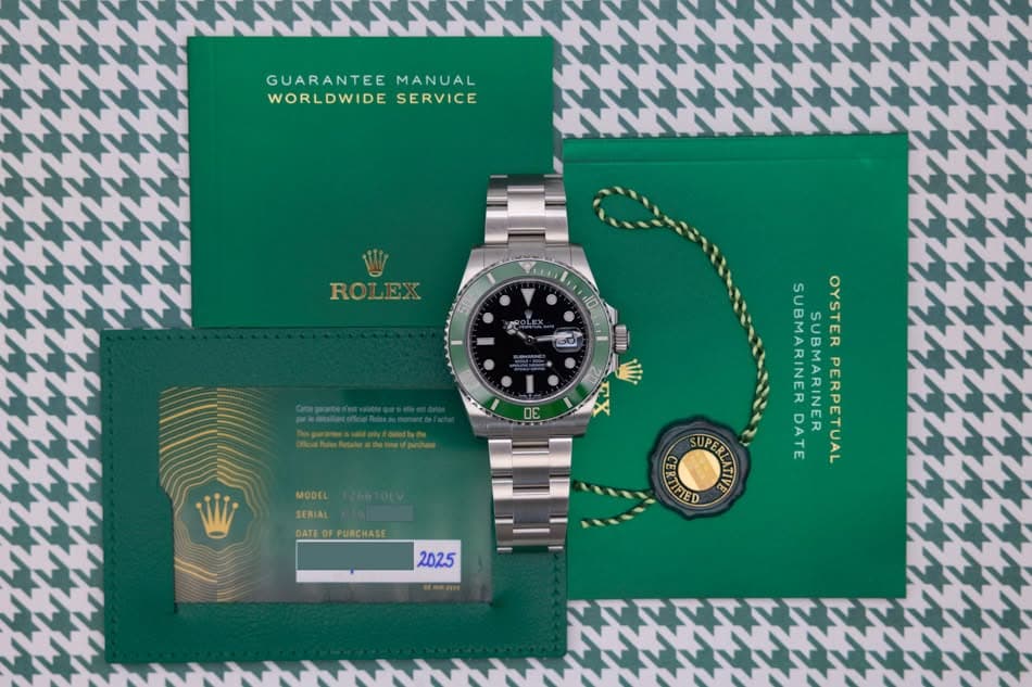 May be an image of wrist watch and text that says 'GUARANTEE GUARANTEEMANUA MANUAL WORLDWIDESERVICE WORLDWIDE SERVICE ROLEX 50 A 10 副川 Ili DE MODEL SERIAL DATE ATEO PURCHASE…