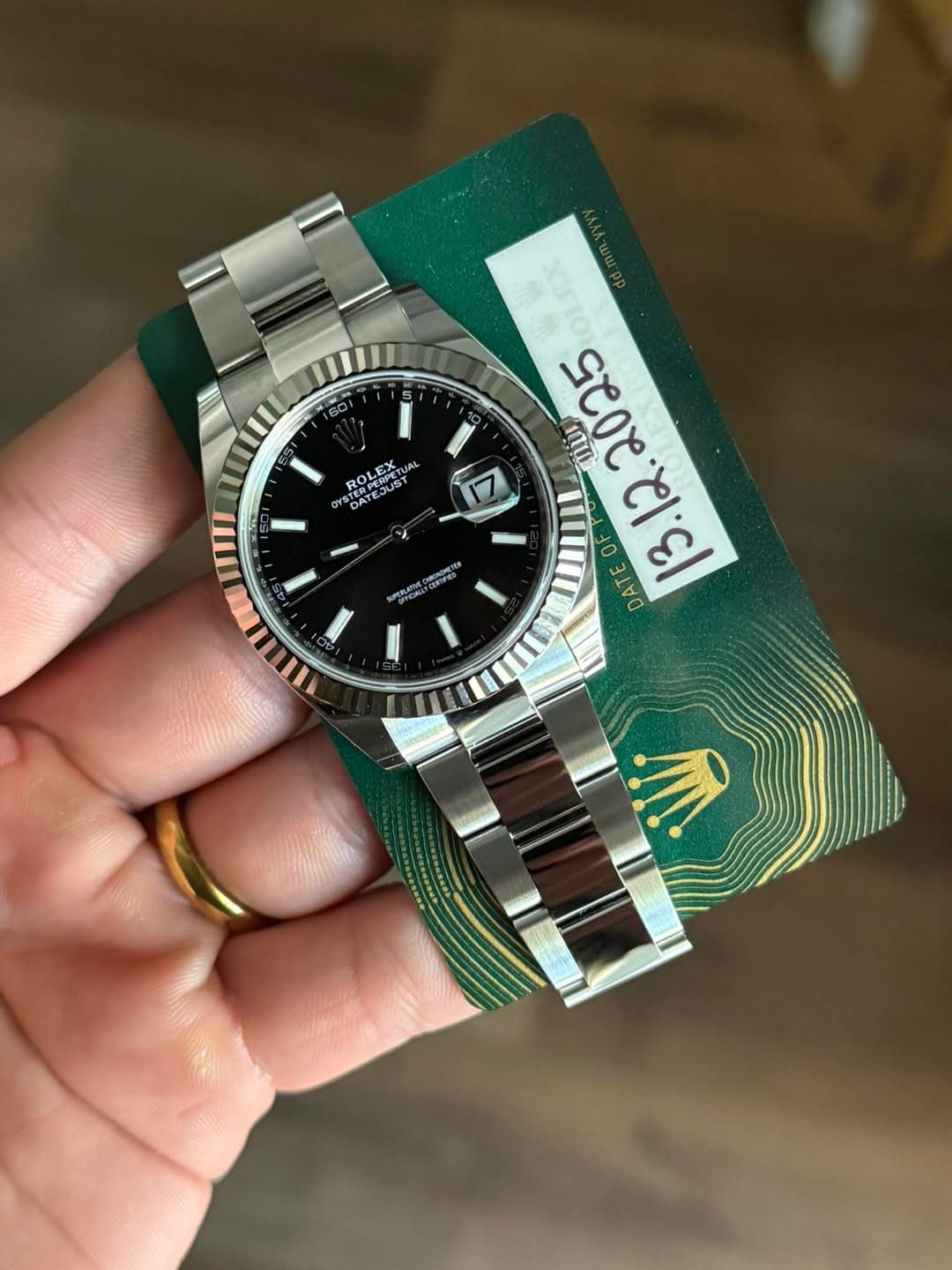 May be an image of wrist watch and text