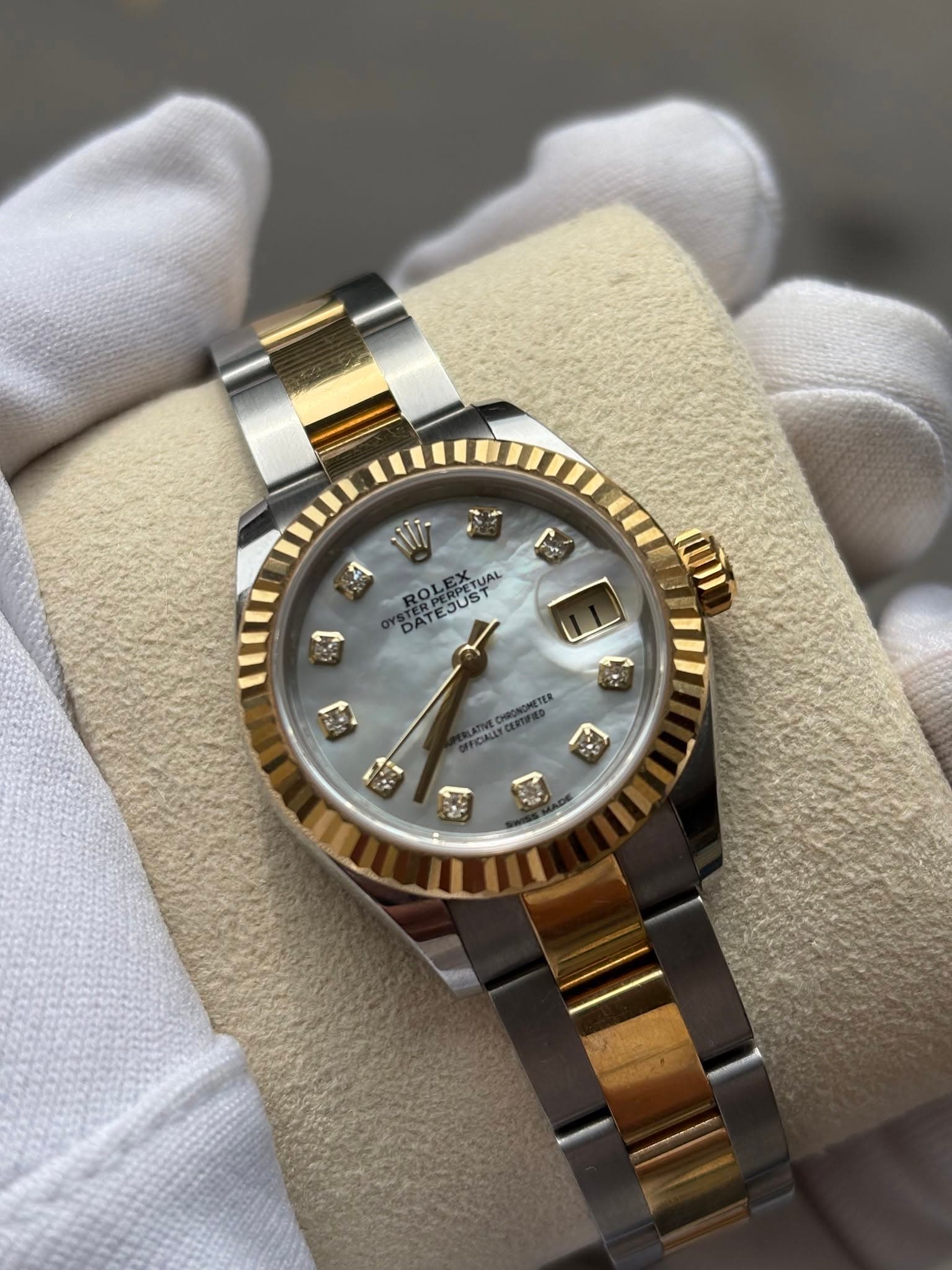 May be an image of wrist watch and text