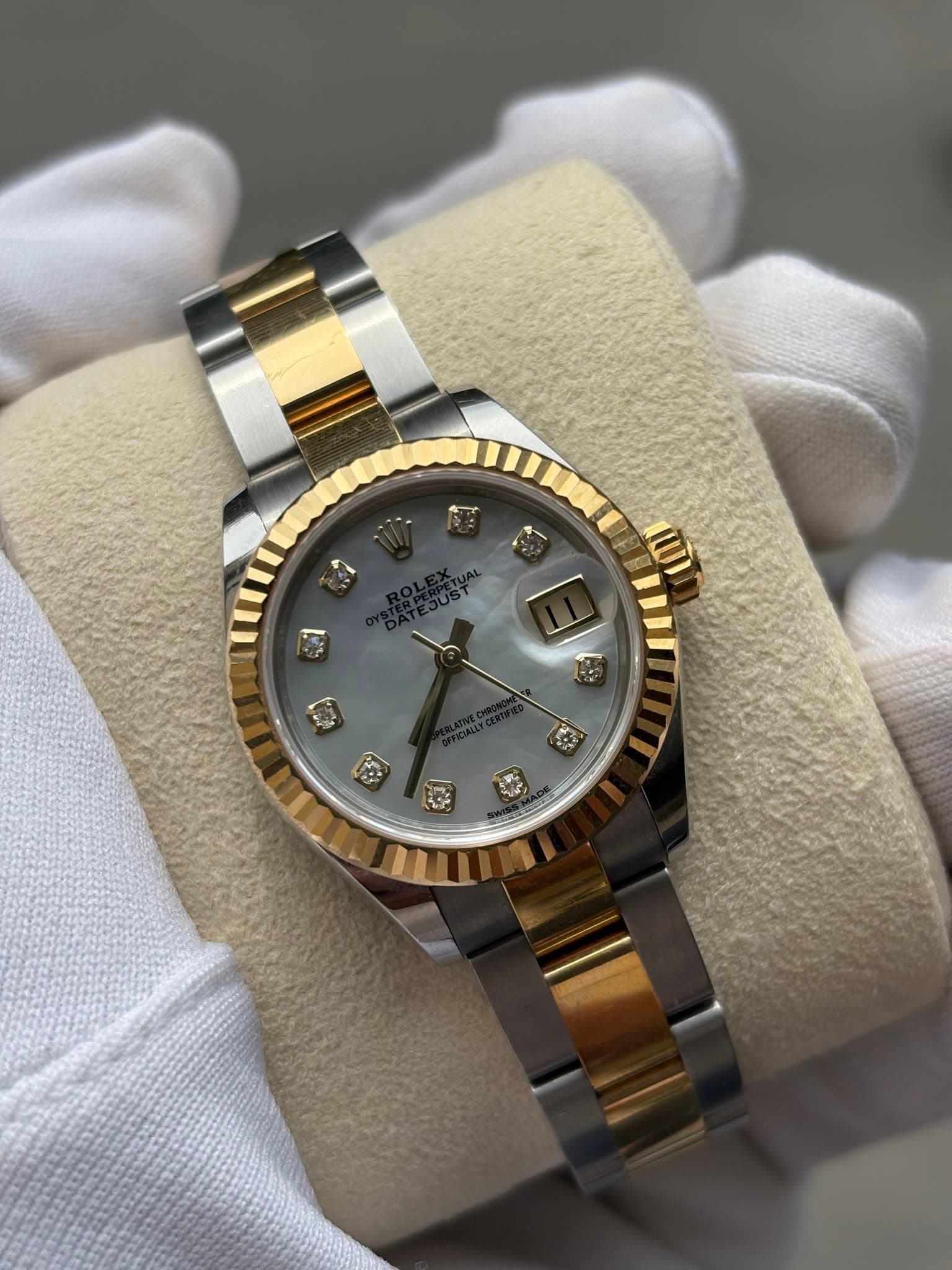May be an image of wrist watch and text
