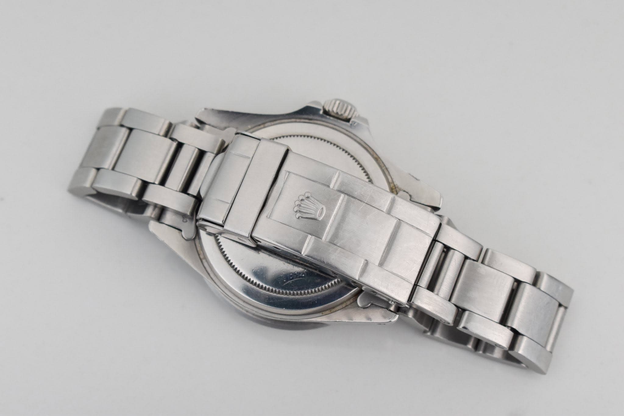 May be an image of wrist watch and text