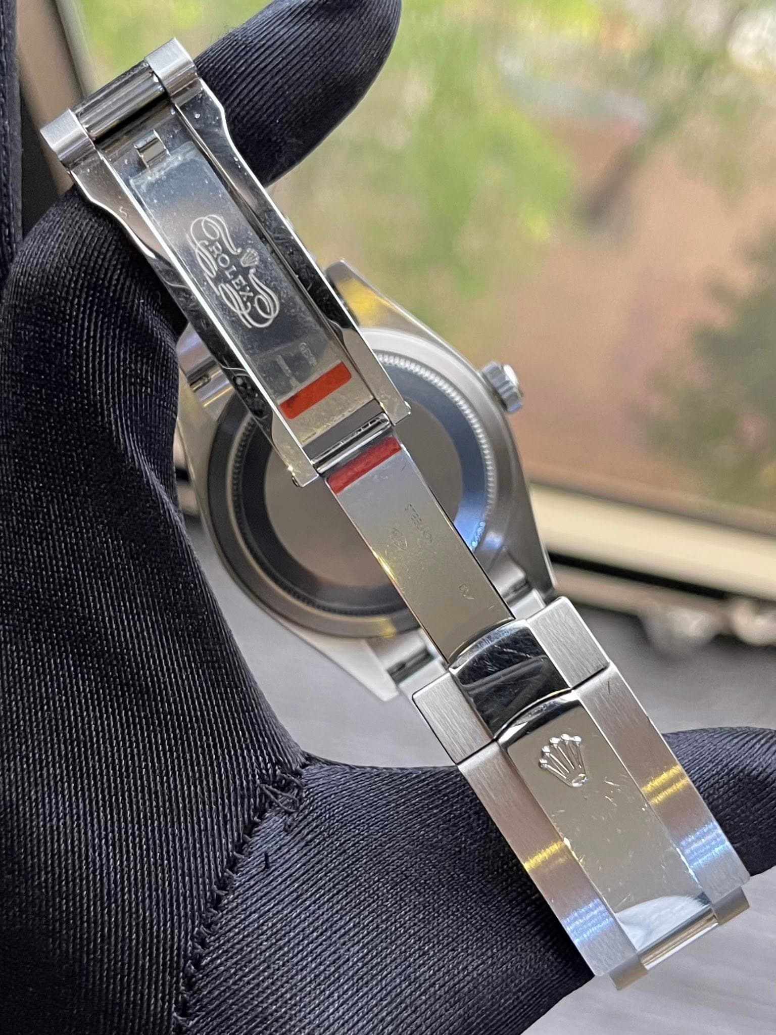 May be an image of wrist watch and text