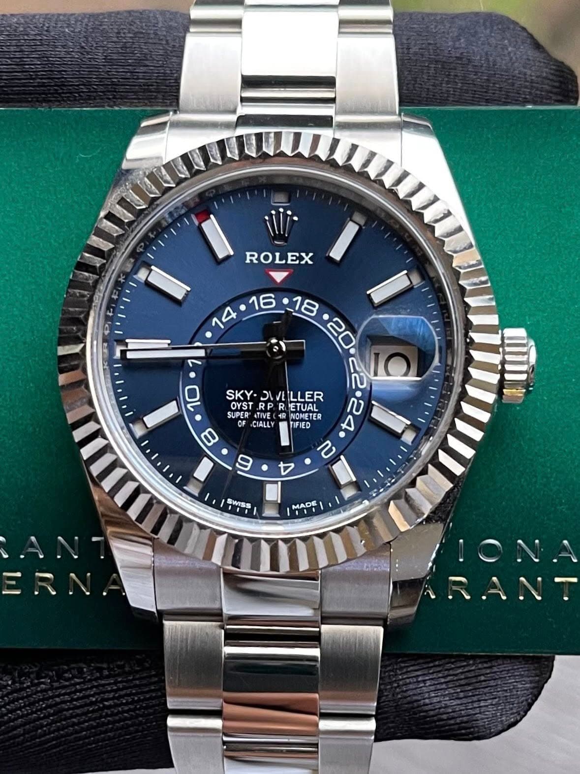 May be an image of wrist watch and text