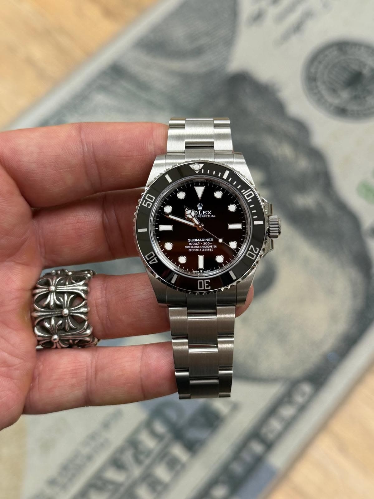 May be an image of wrist watch and text that says '50 10 OLEX EX SUBMARINER SUPERLATVE 40 20 30'