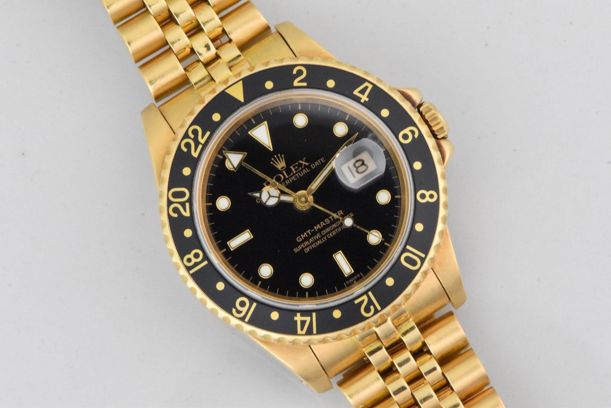May be an image of wrist watch and text