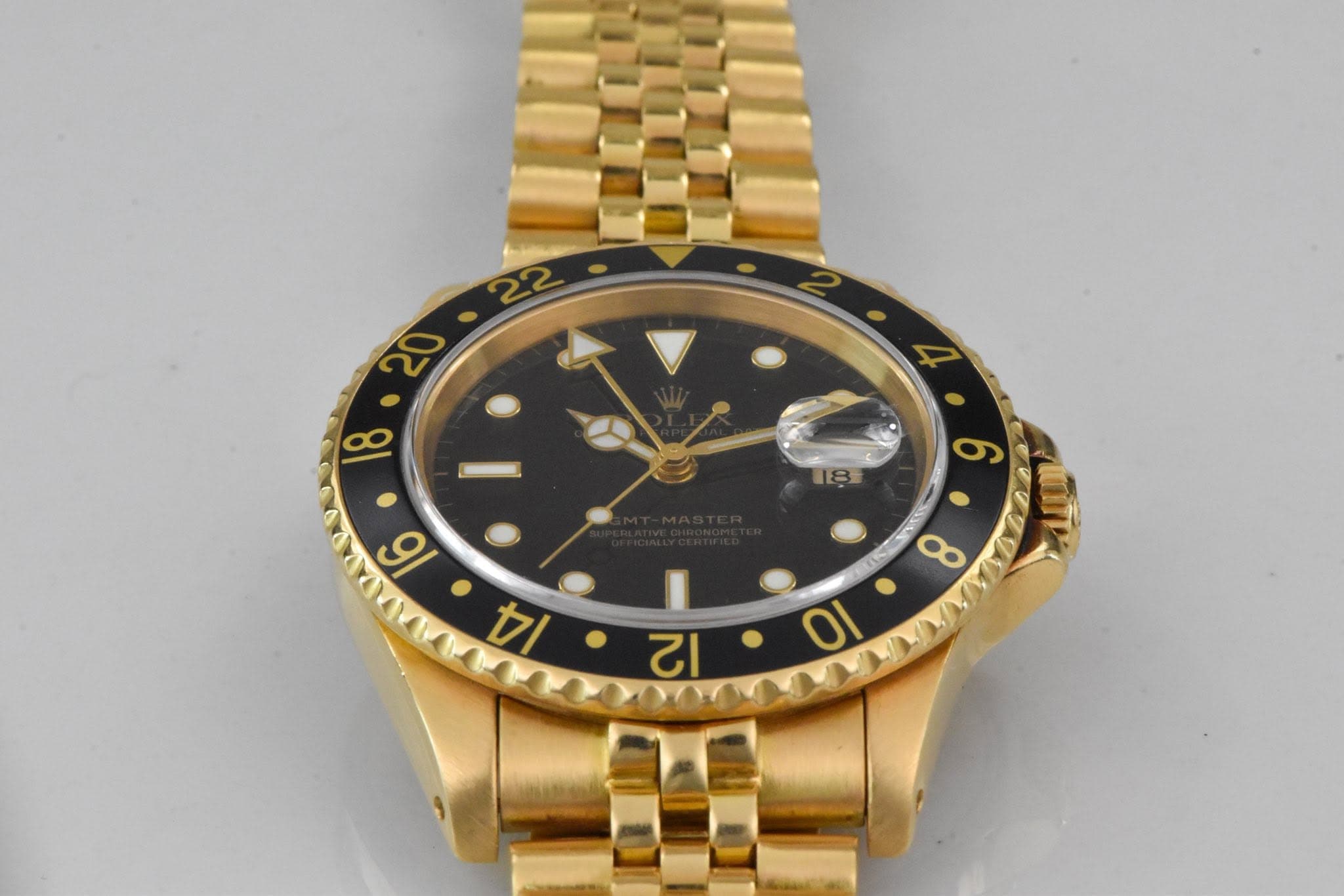 May be an image of wrist watch and text