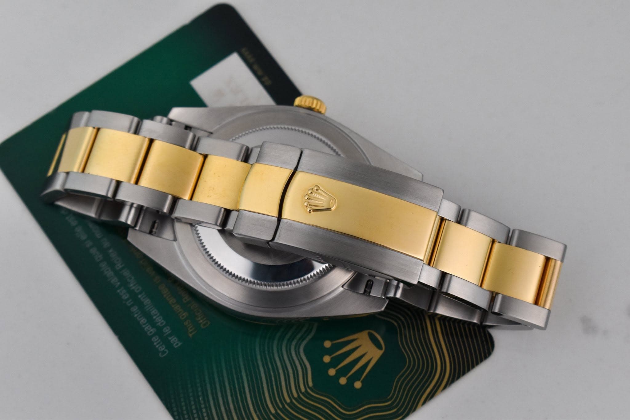 May be an image of wrist watch and text