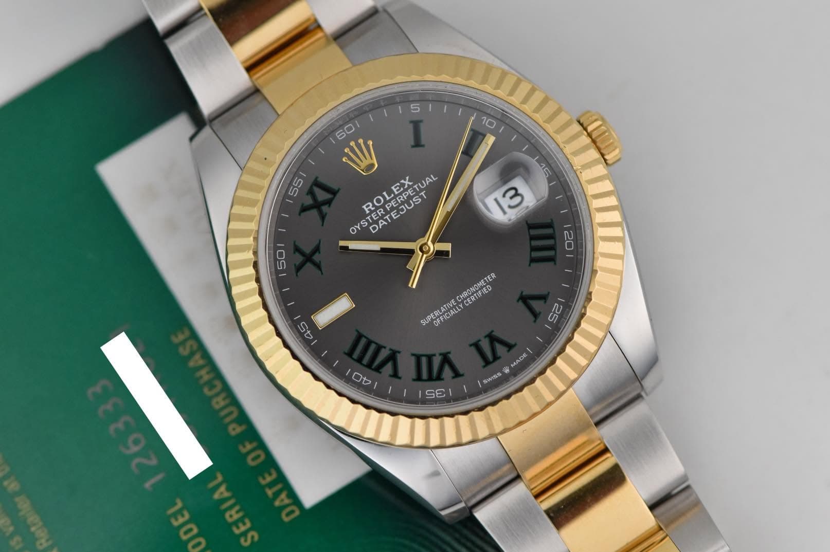 May be an image of wrist watch and text that says ' OYS OYSTERP YSROLEX OYSTER DATEJUST DAT TEJUST ROLEX PERPETU UAL 50 20 CHRONGMETER ETER ER CERTIFIED SUPERL PERLAIES OFFICIALLYβ¦