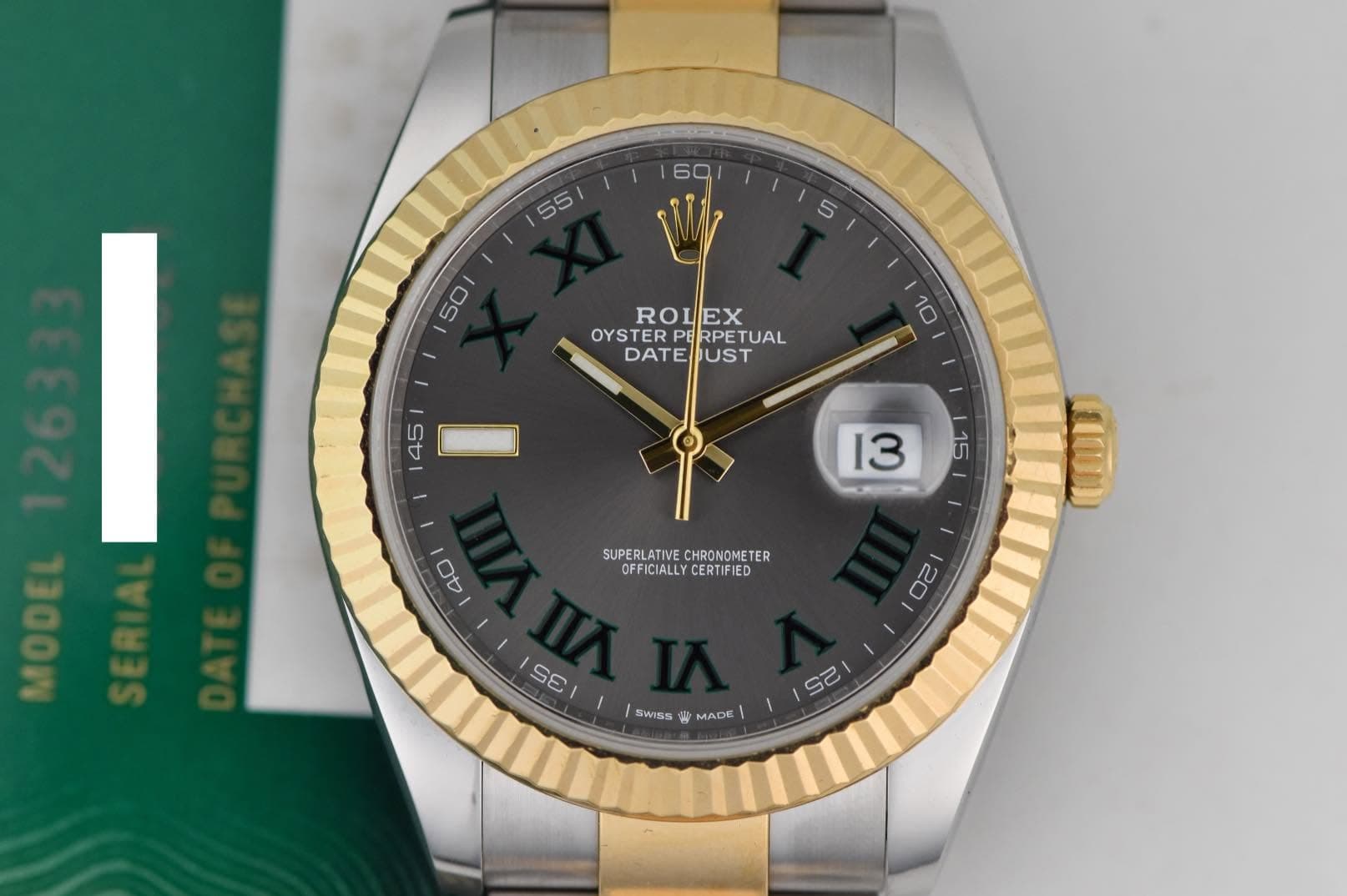 May be an image of wrist watch and text that says ' ROLEX OYSTER OYSTERPERPETUA RPETUAL DATE UST SUPERLATIVE.CHRONONETER OFFICIALLYCERTIFIED SUPERLATIVE CHRONOMETER ER OFFICIALLYβ¦