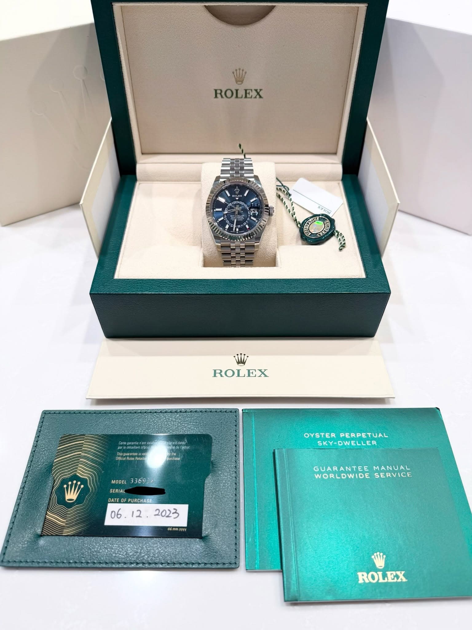 May be an image of wrist watch and text that says 'W ROLEX ON AYTCI 吉 W ROLEX OYSTER DYSTERPERPETUAL PERPETUAL SKY-DWELLER MODEL 336972 SERIAL SERIAL DATEOFPURENASE PURCHASE…