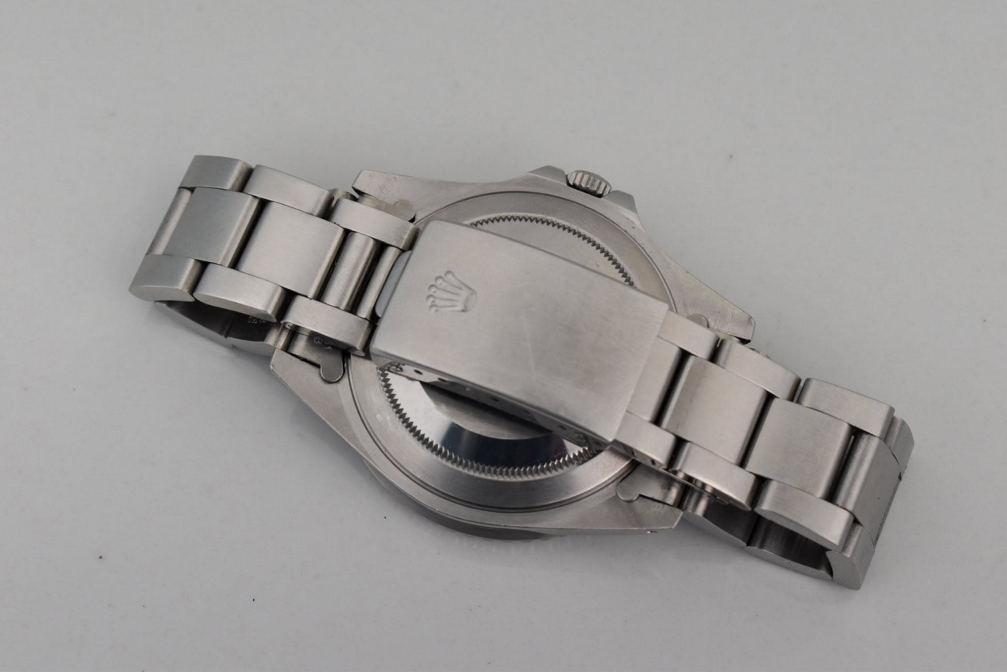 May be an image of wrist watch and text