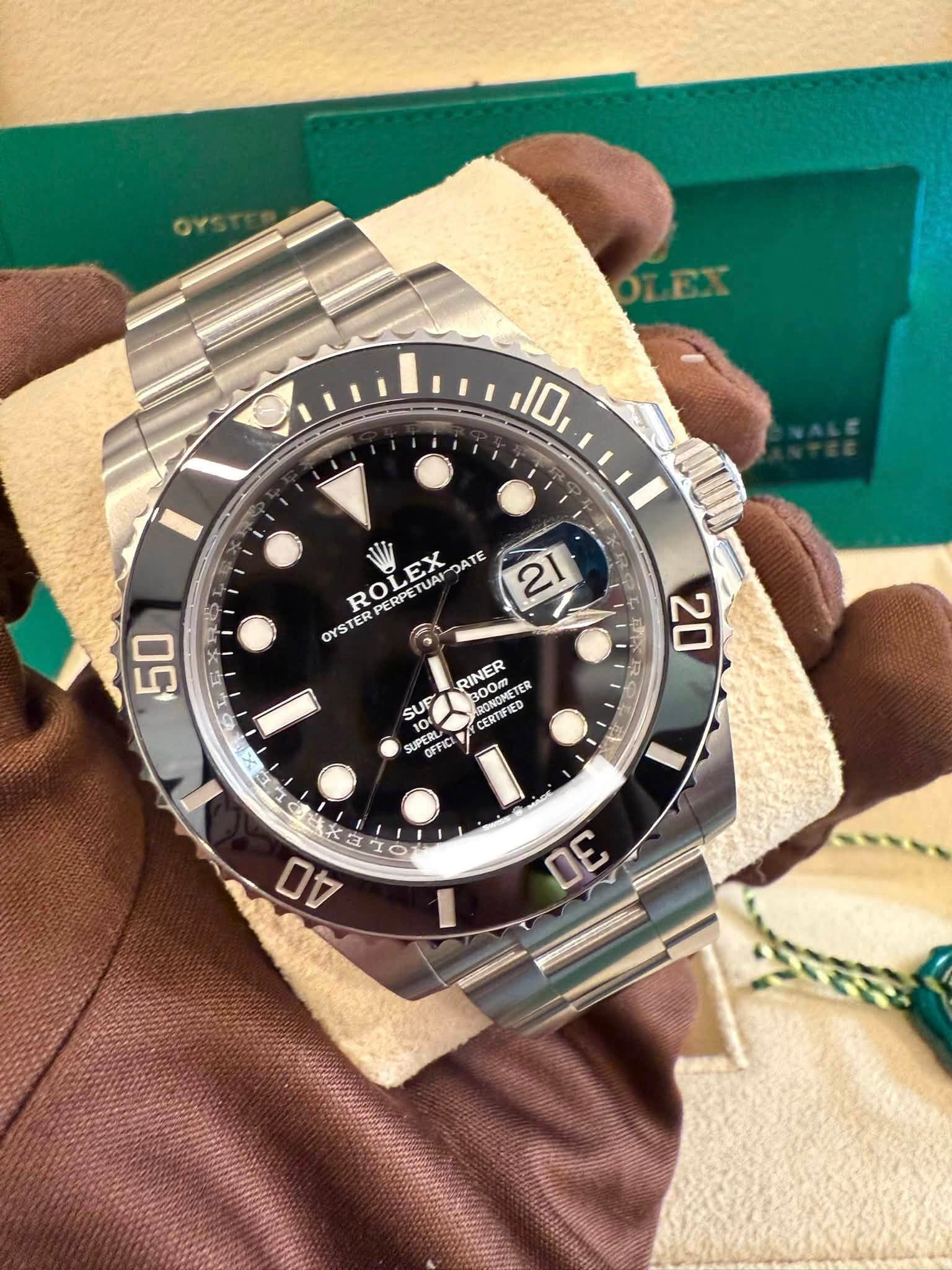 May be an image of wrist watch and text that says '10 ROLEX R DATE 21 PERP OYSTER P PERPETU EX TUAI TUA 50 6P. 20 RINER TER SUF ARONOMETE 100 pa C PENK UPERL OFFIC CERTIFRED 焼り I I…