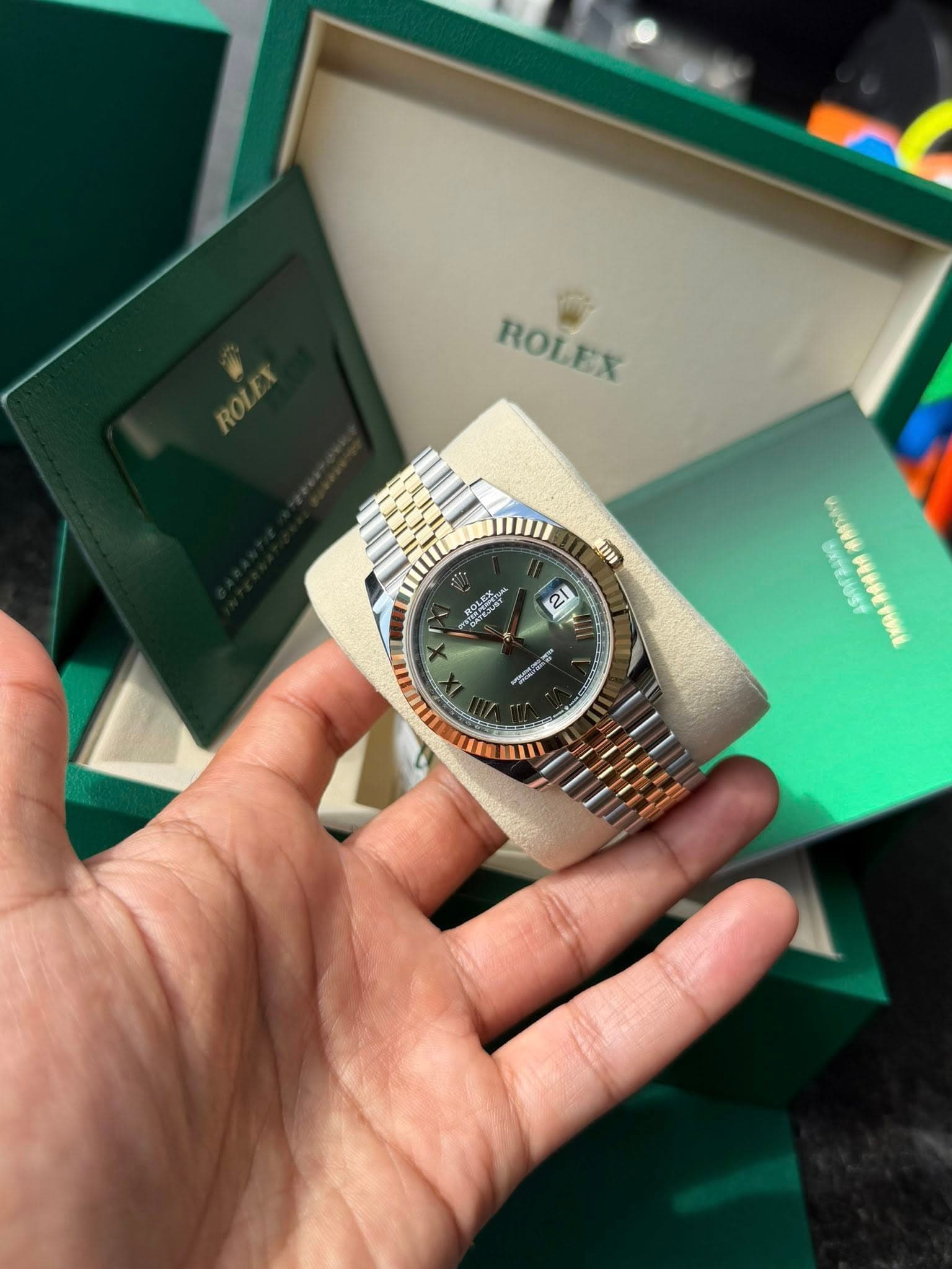 May be an image of wrist watch and text