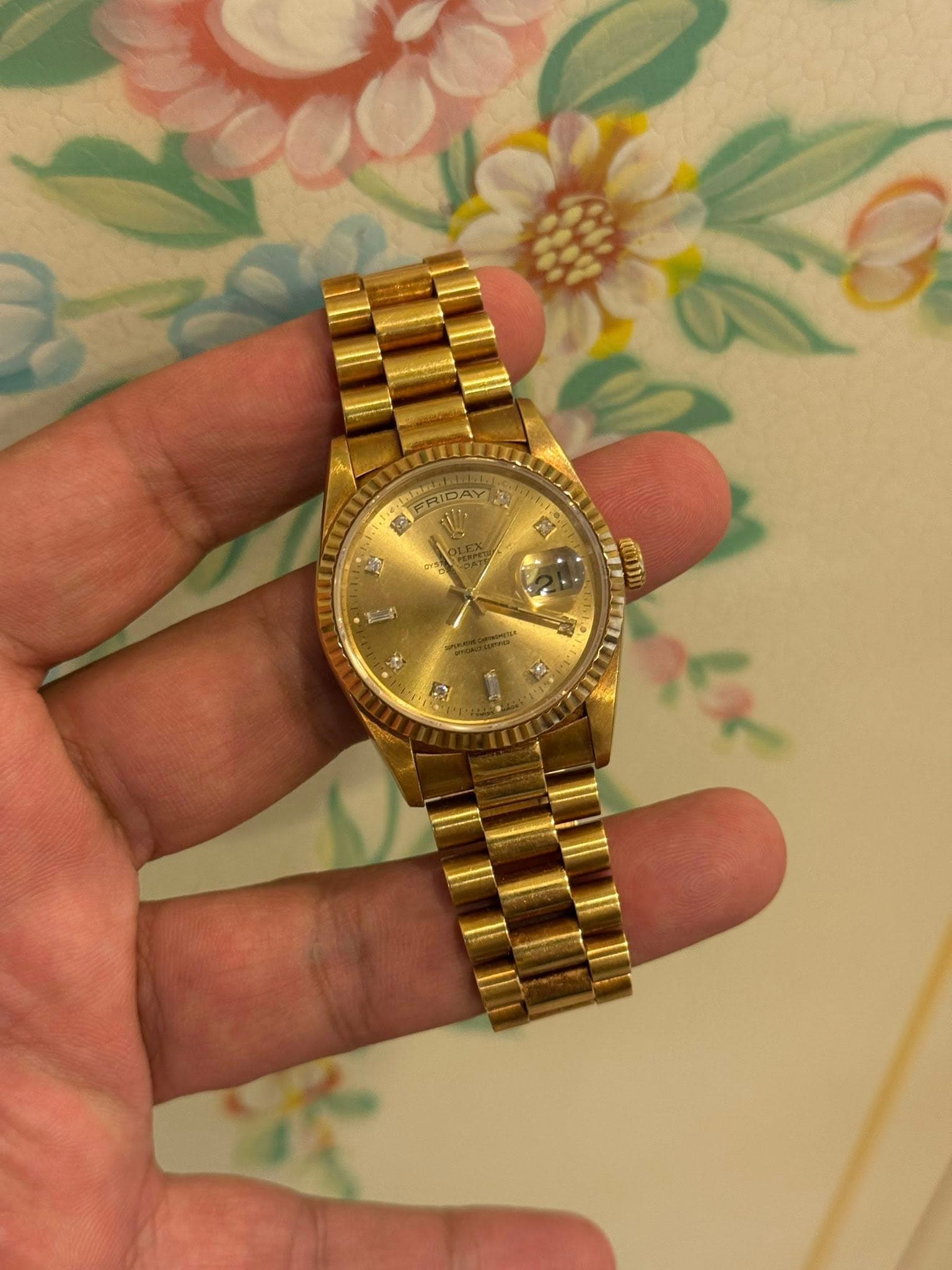 May be an image of wrist watch and text