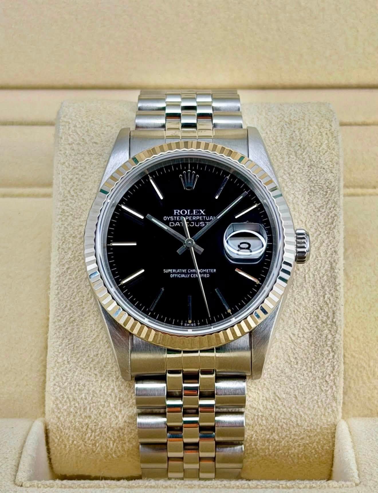 May be an image of wrist watch and text