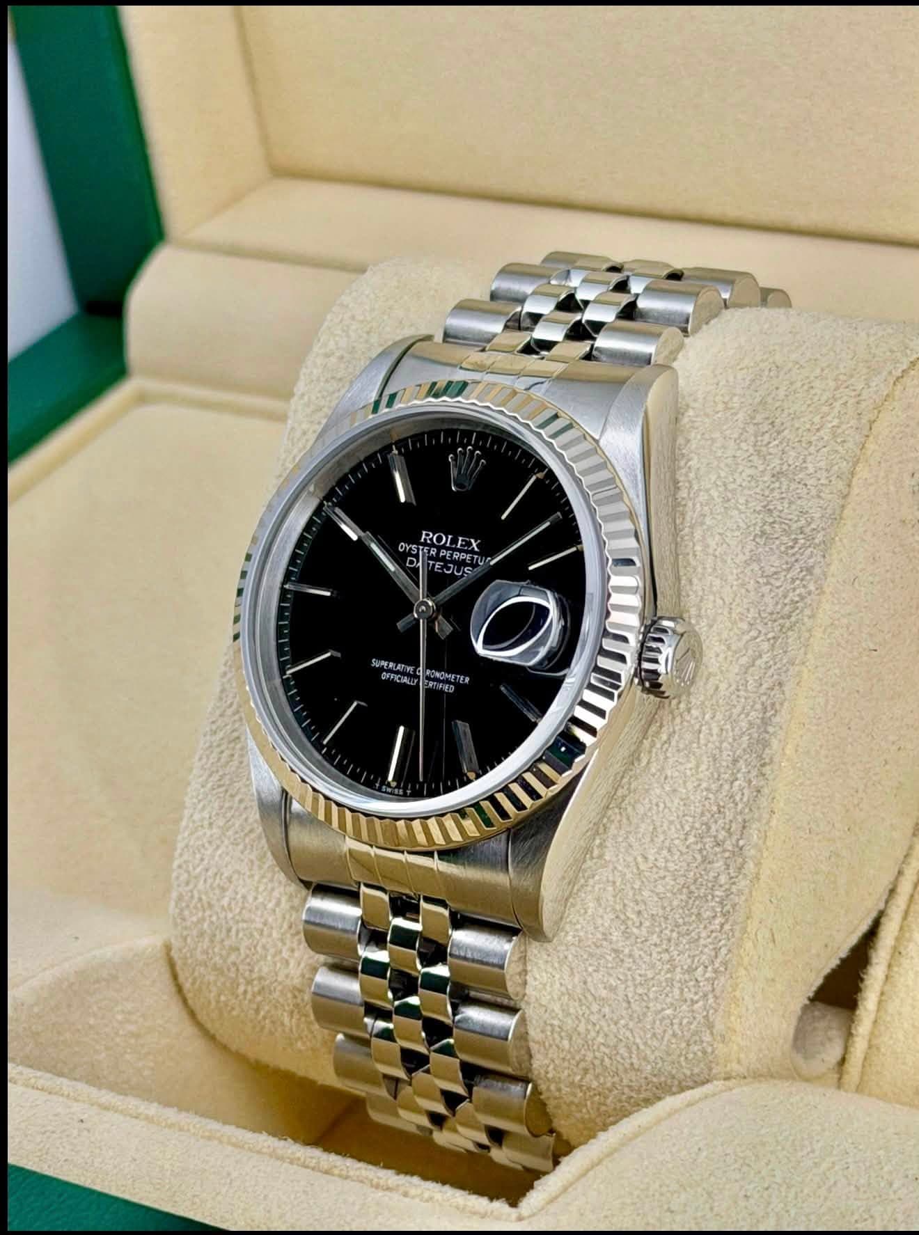 May be an image of wrist watch and text