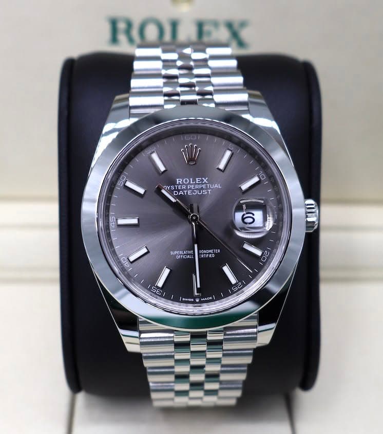 May be an image of wrist watch and text that says 'ROLEX 50 ROLEX OYS YSTER ERPERPETUAL ROLRPETUAL TUAL DATEJUST DAT TEJUST 10 45 国1 ช 6 LPERLATIVE 40 ONOMET ER RTIFIED 2 20 25 2I…