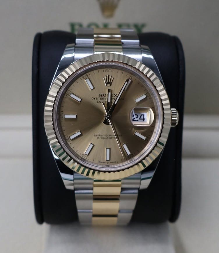 May be an image of wrist watch and text