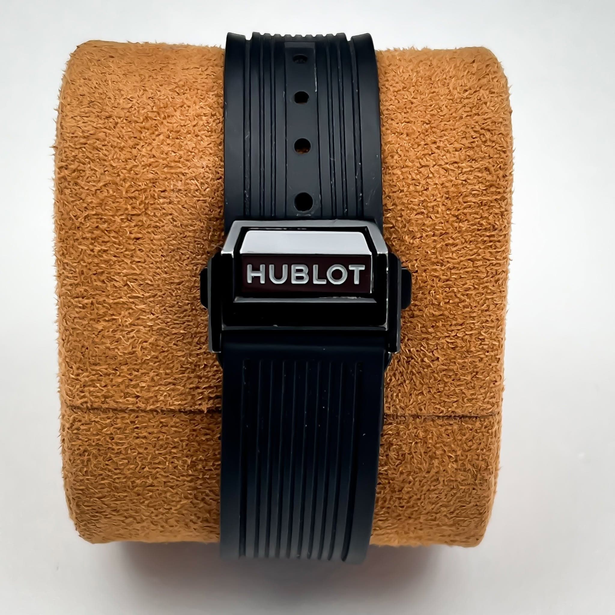 May be an image of digital watch, leather and text that says 'HUBLOT'