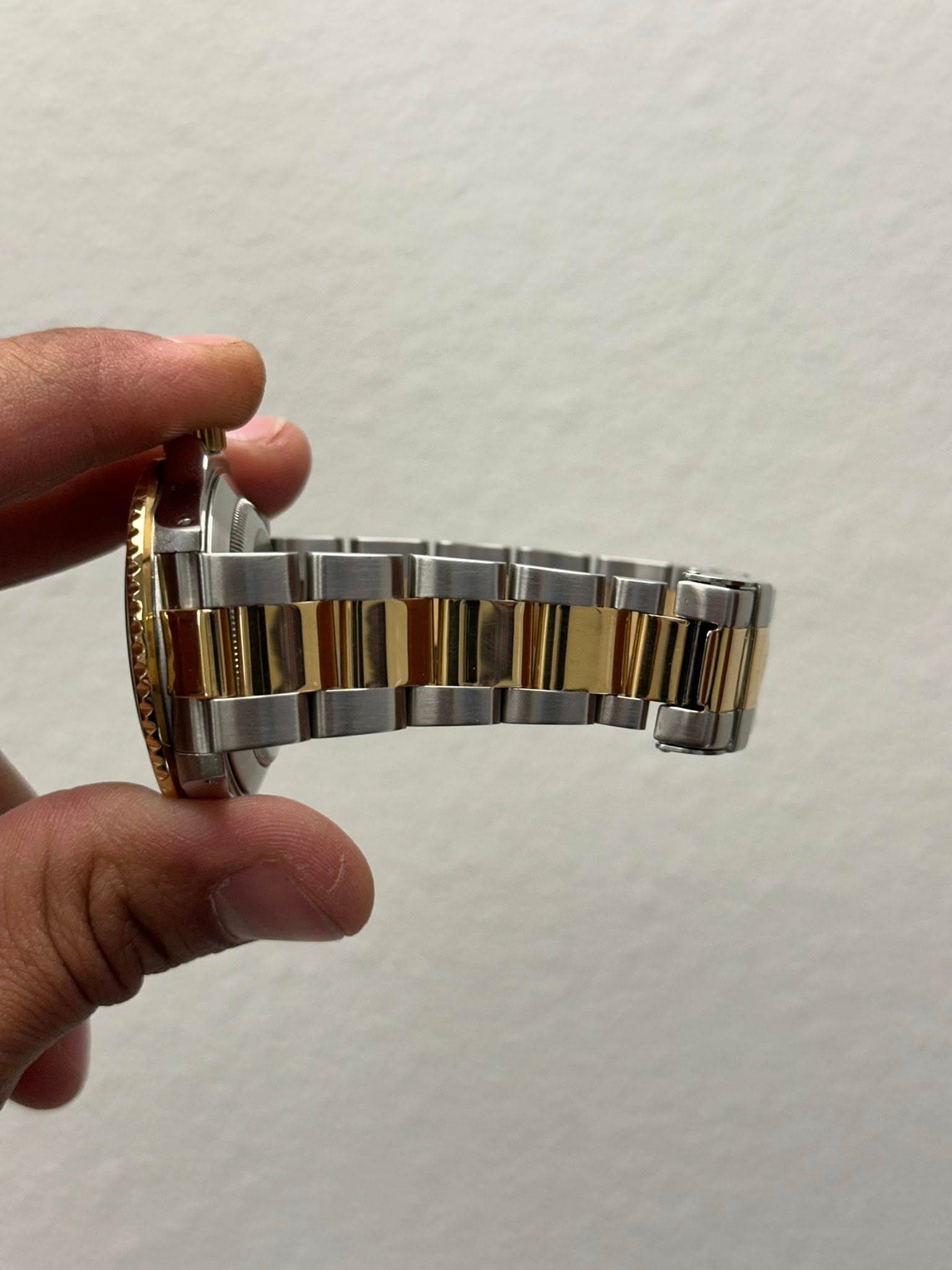 May be an image of wrist watch