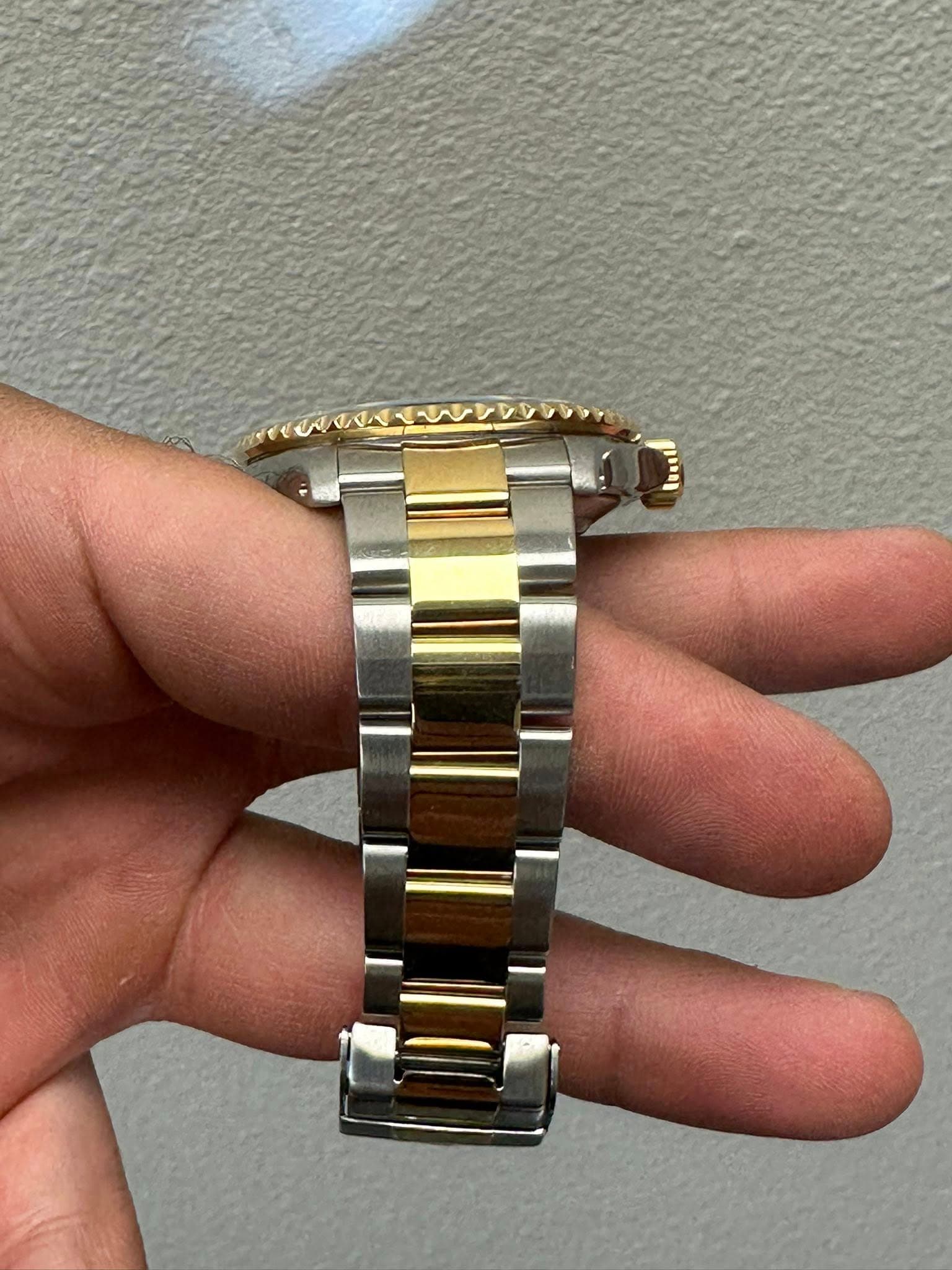 May be an image of wrist watch