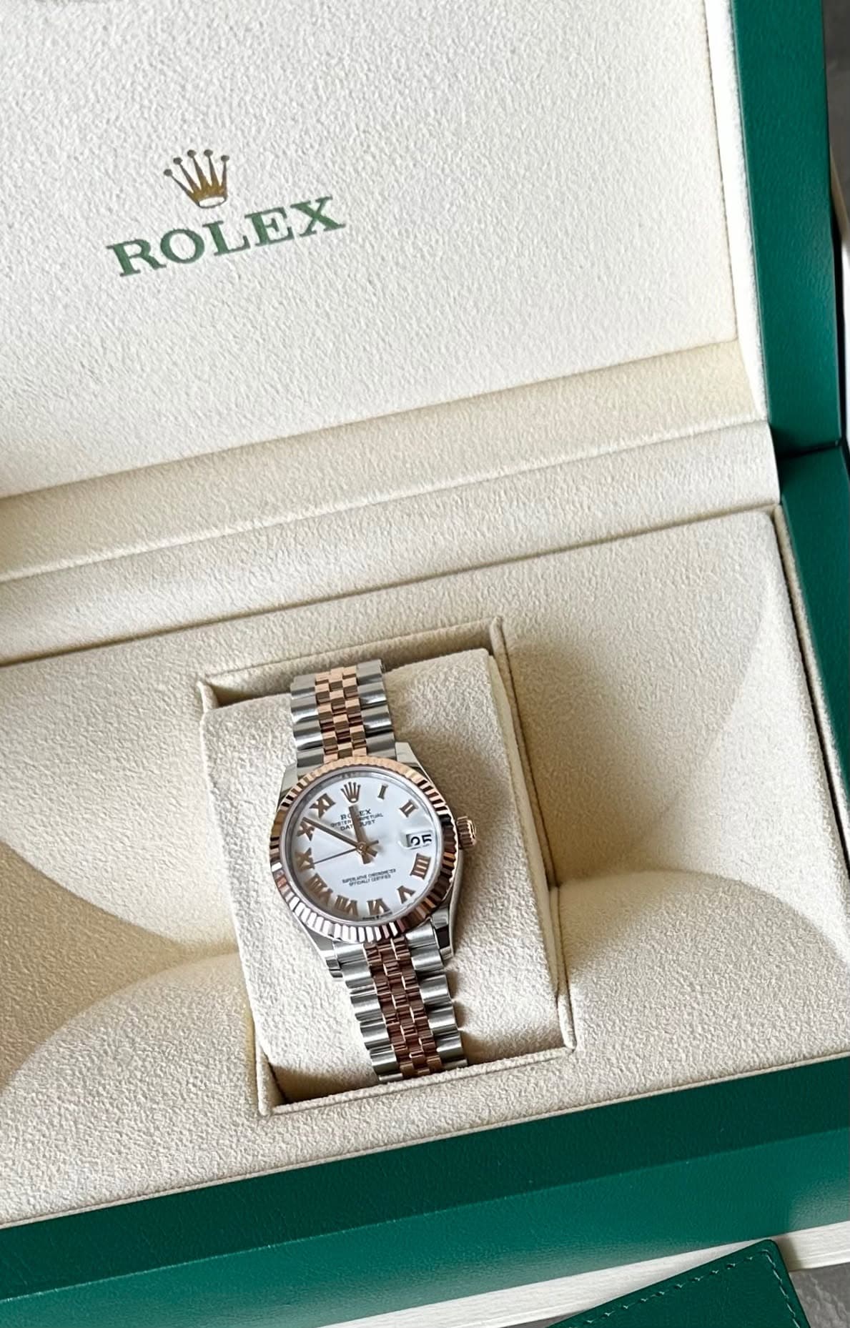 May be an image of wrist watch and text