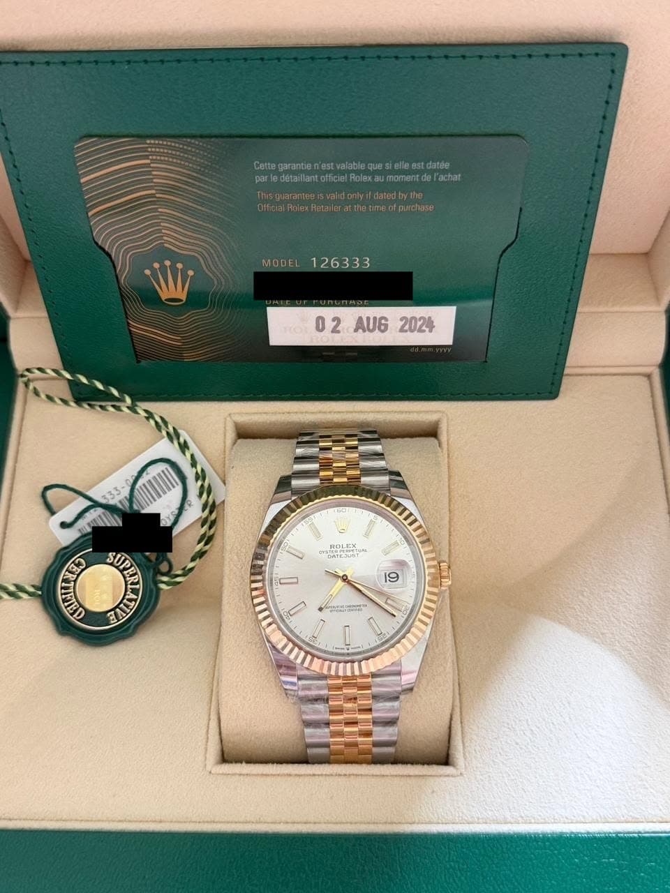 May be an image of wrist watch and text