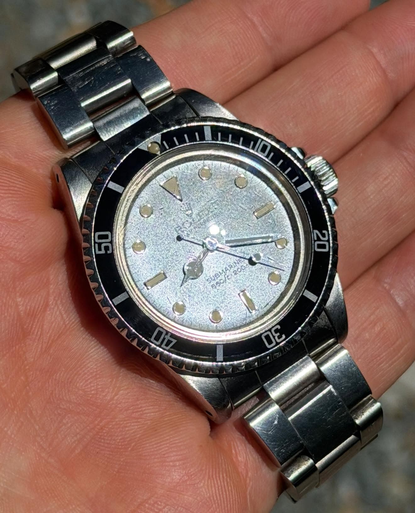 May be an image of wrist watch and text