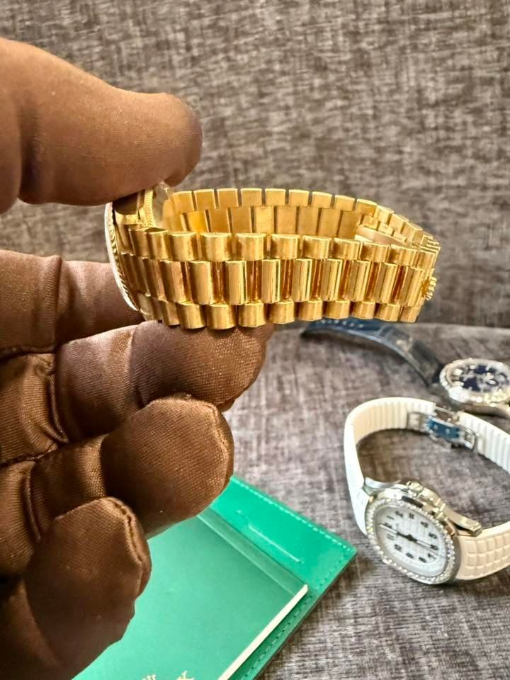 May be an image of wrist watch and text
