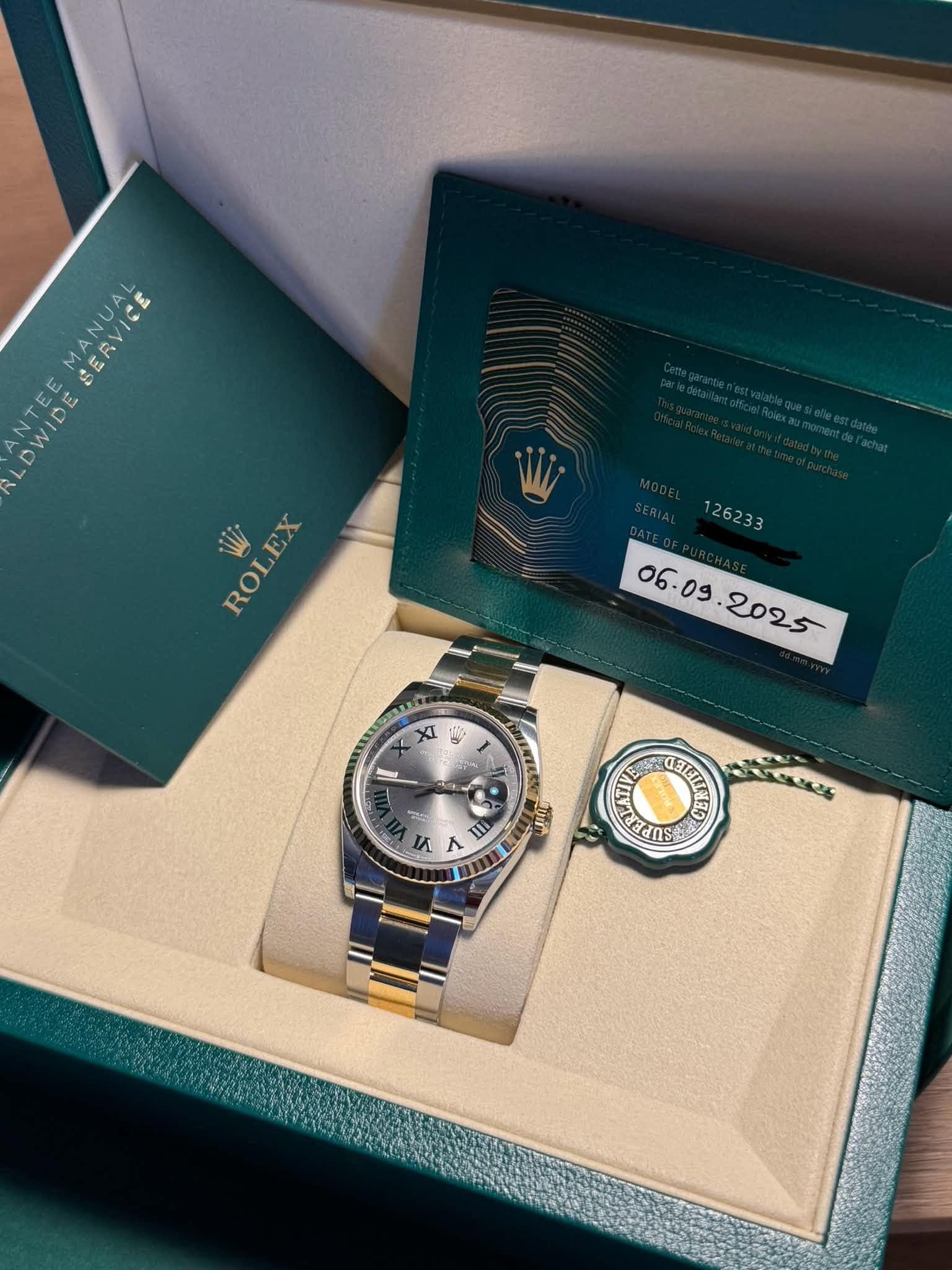 May be an image of wrist watch and text that says 'SERVICE E DWID W ROLEX XI 0 行 ® un И 台 ሠሉ CTTCTP'