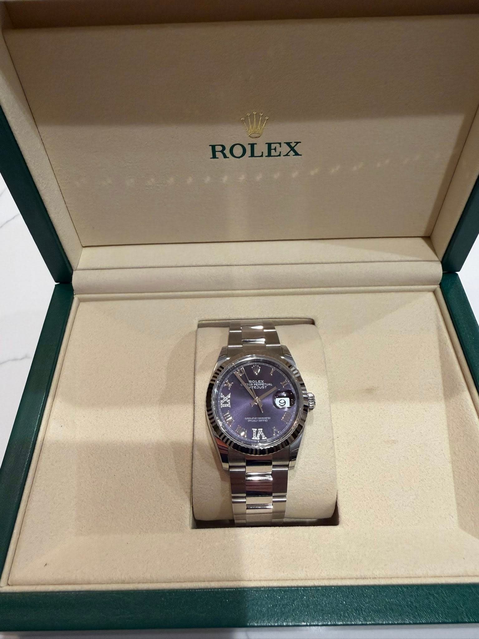 May be an image of wrist watch and text that says 'ROLEX IA'