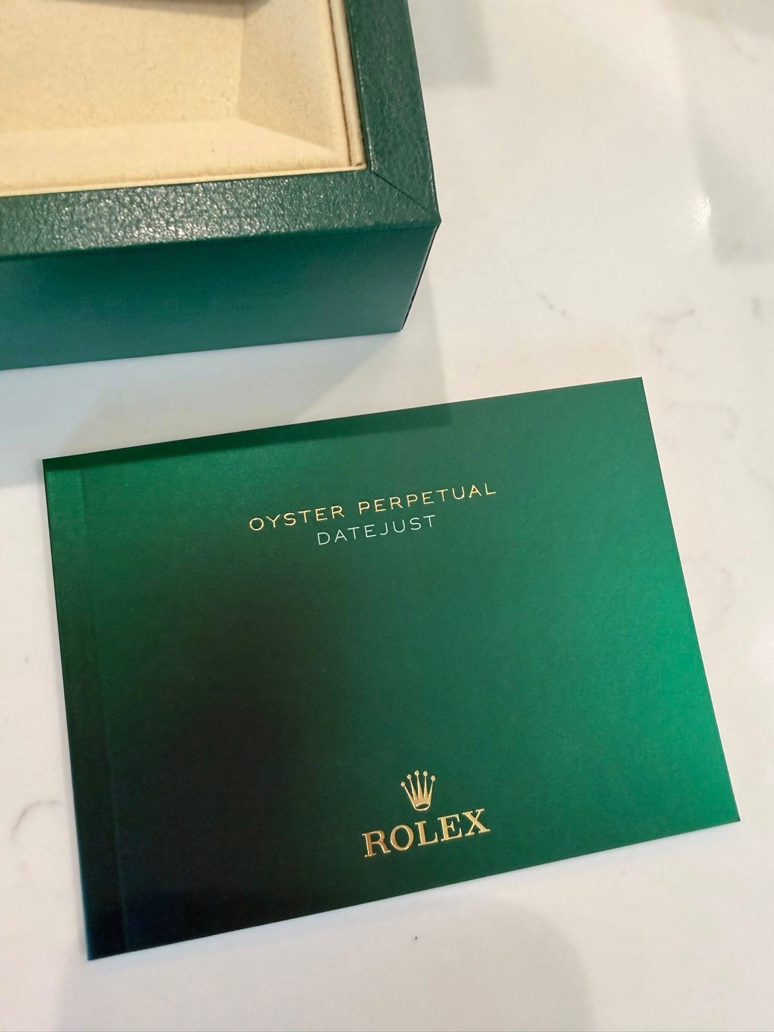 May be an image of wrist watch and text that says 'OYSTER PERPETUAL DATEJUST ROLEX ROLEX'