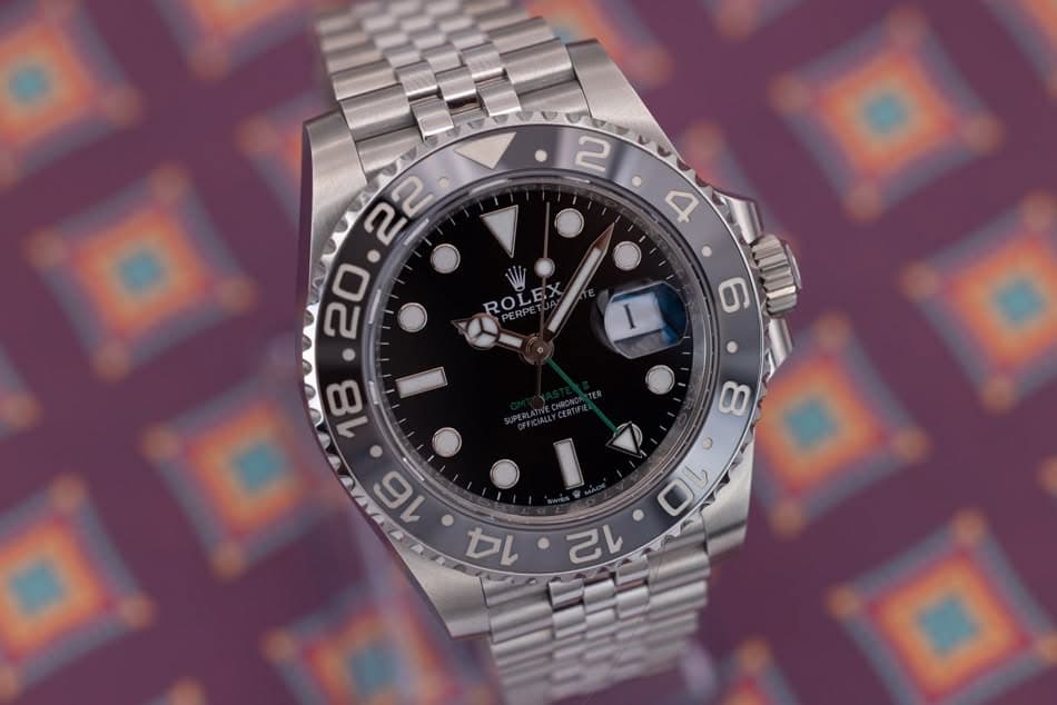 May be an image of wrist watch and text that says ' ROLEX ROLEX ٥ 0٥ O 12'