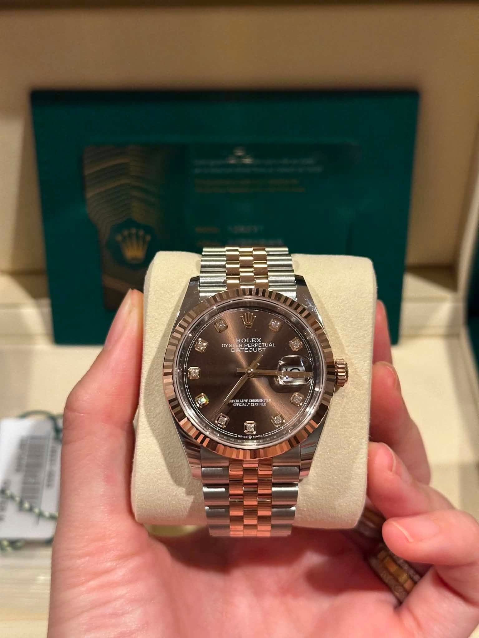 May be an image of wrist watch and text