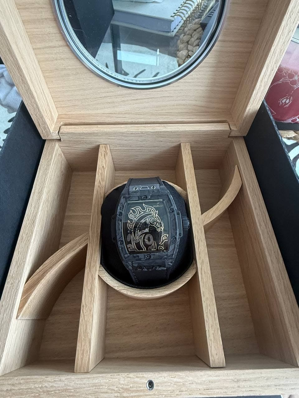 May be an image of wrist watch and text