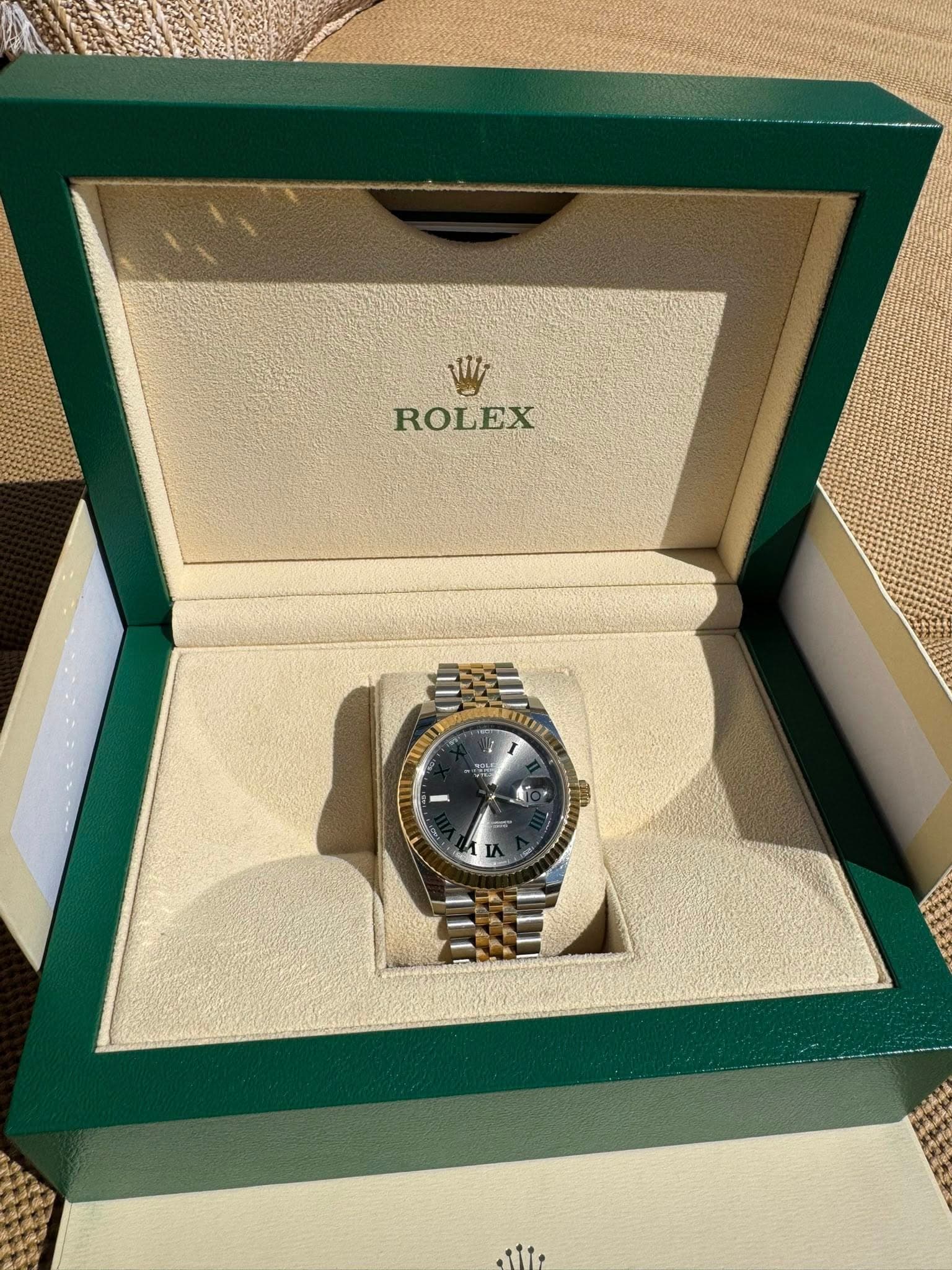May be an image of wrist watch and text