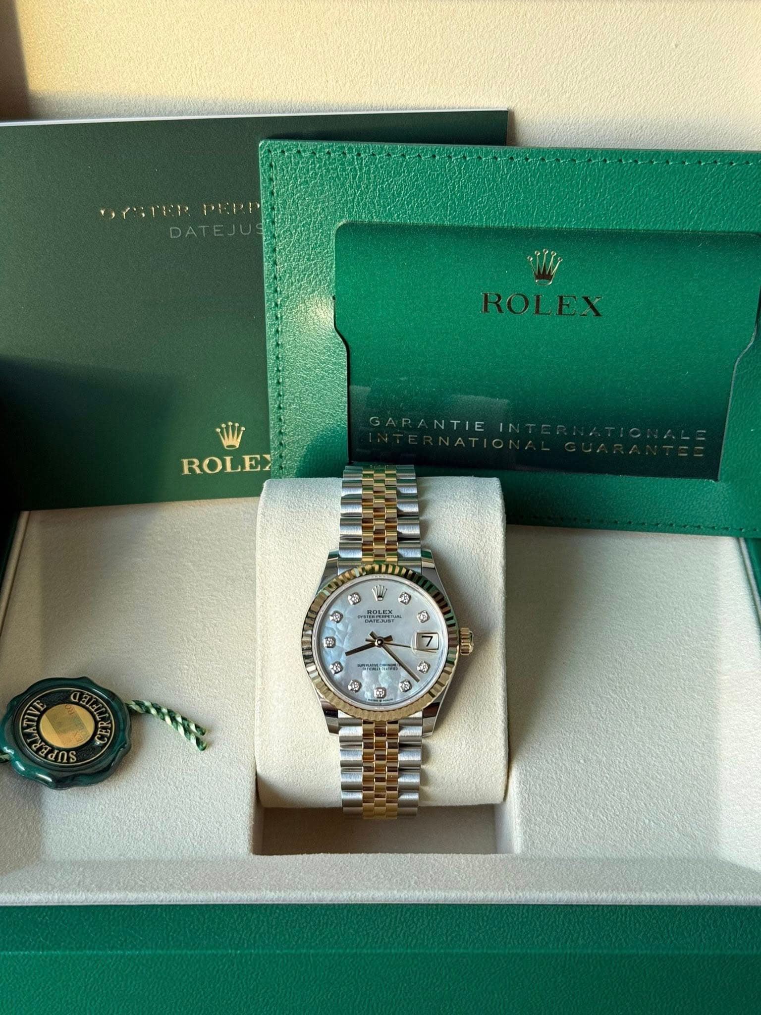 May be an image of wrist watch and text
