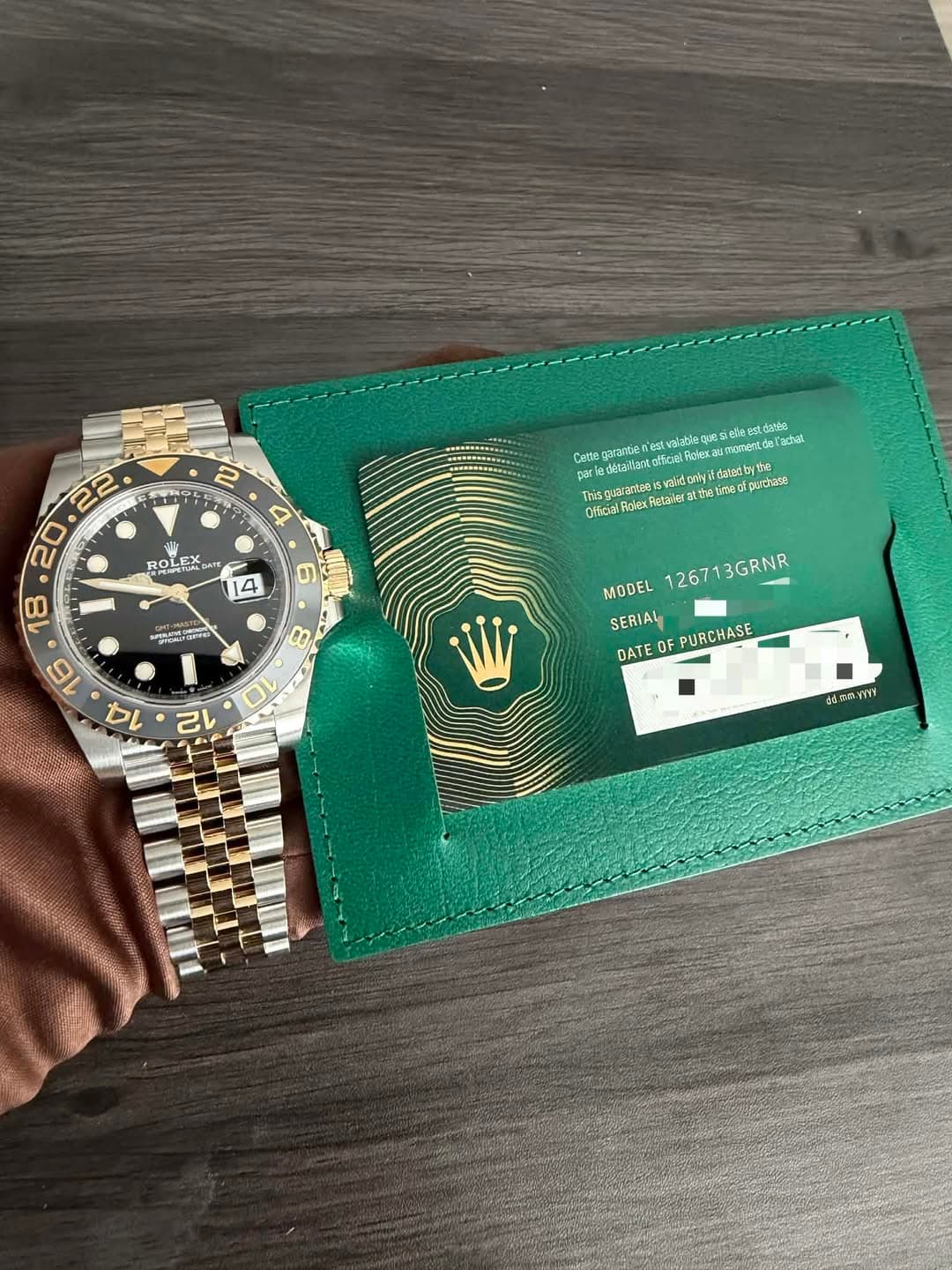May be an image of wrist watch, leather wallet and text