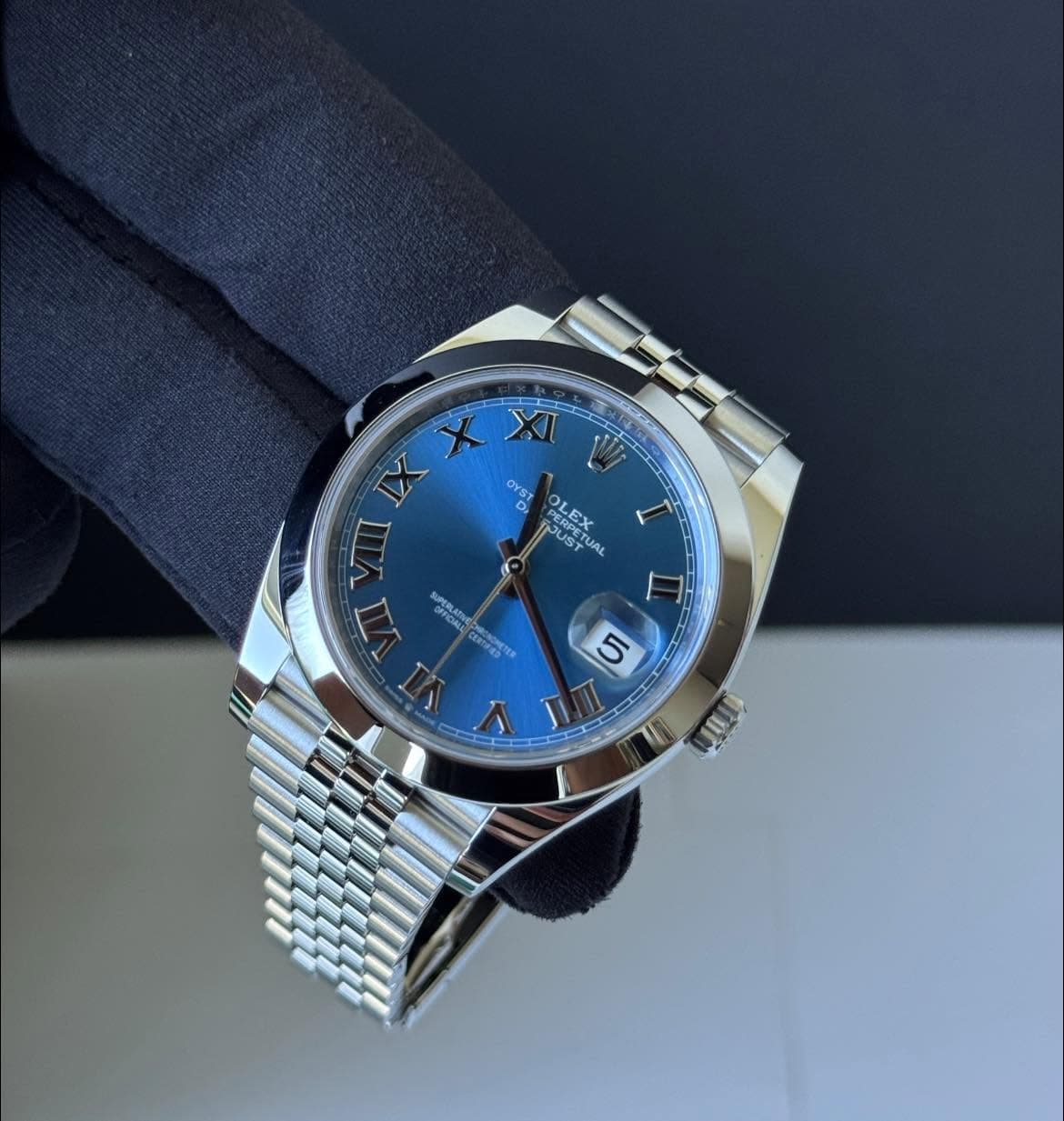 May be an image of wrist watch and text
