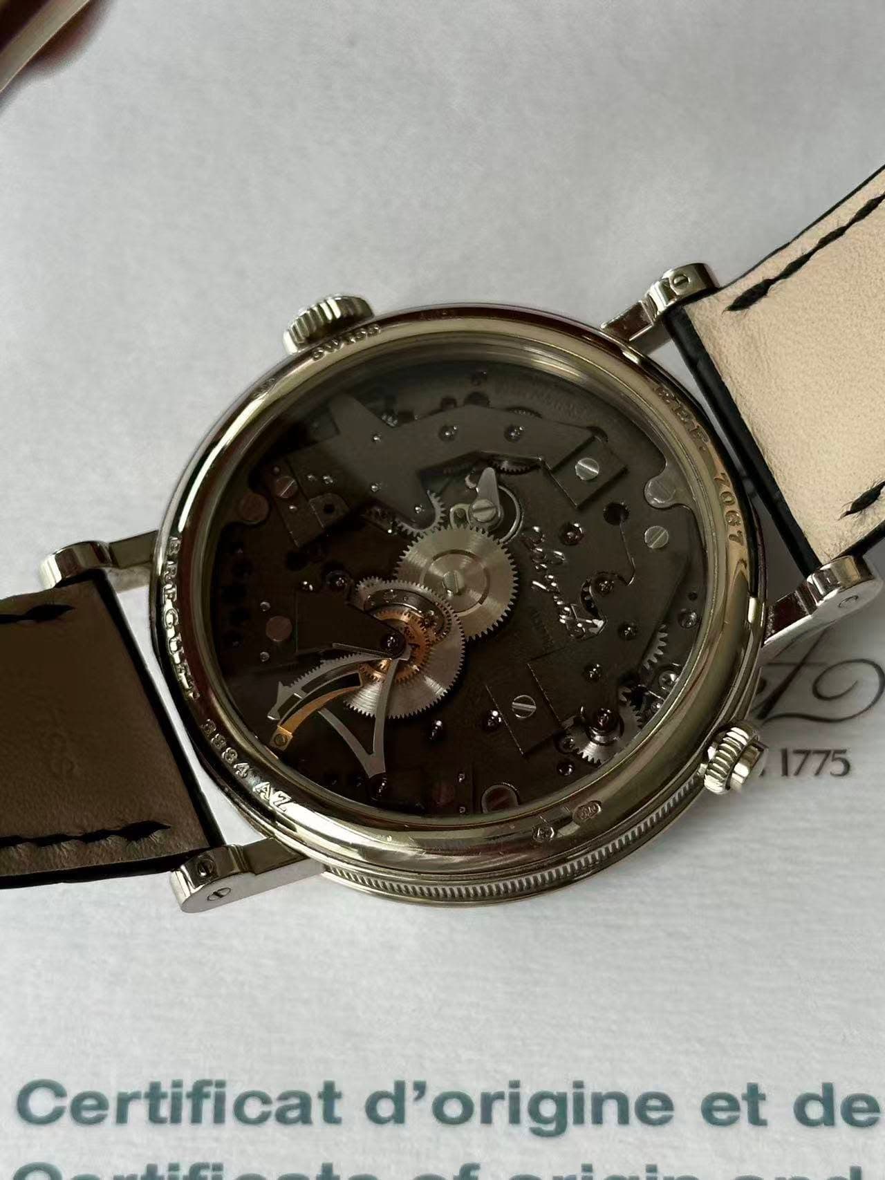 May be an image of wrist watch and text that says '1775 Certificat d'origine et de'