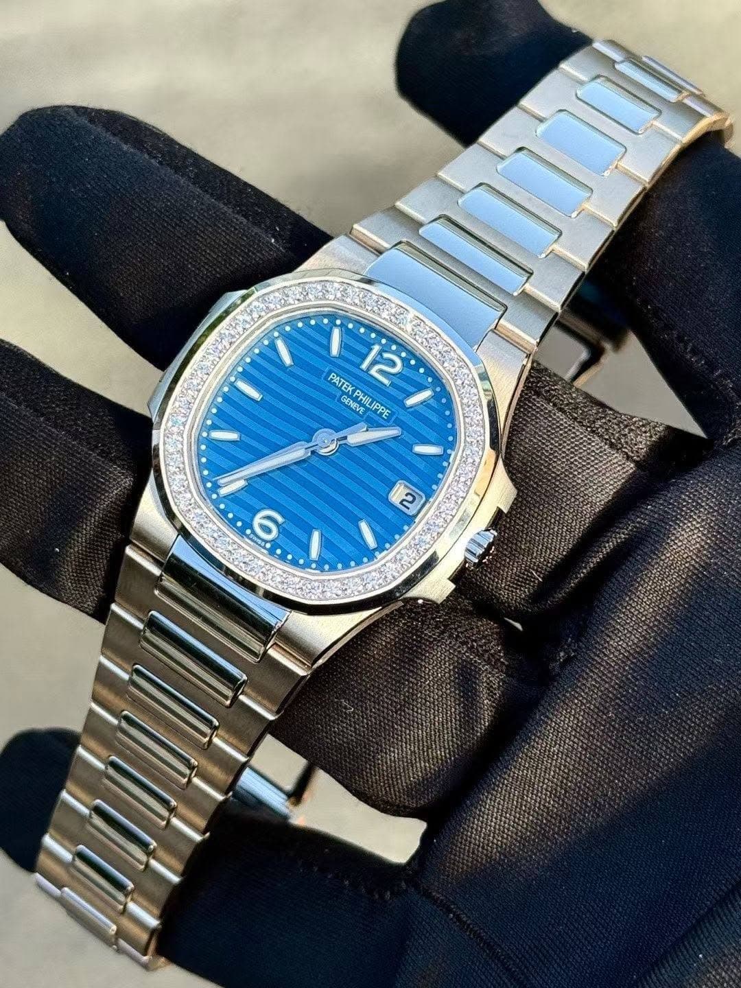 May be an image of wrist watch and text that says 'PATEK اجي 12 GENEVE RYE PHILIPPE PPE ល ம SNC60'