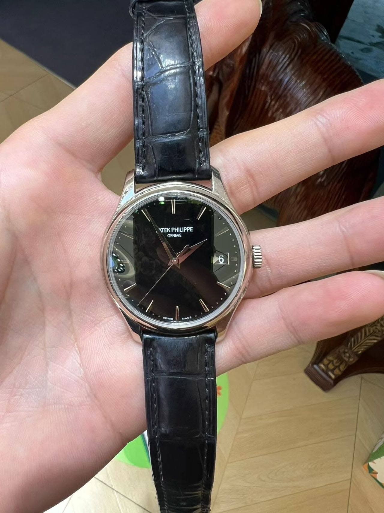 May be an image of wrist watch and text