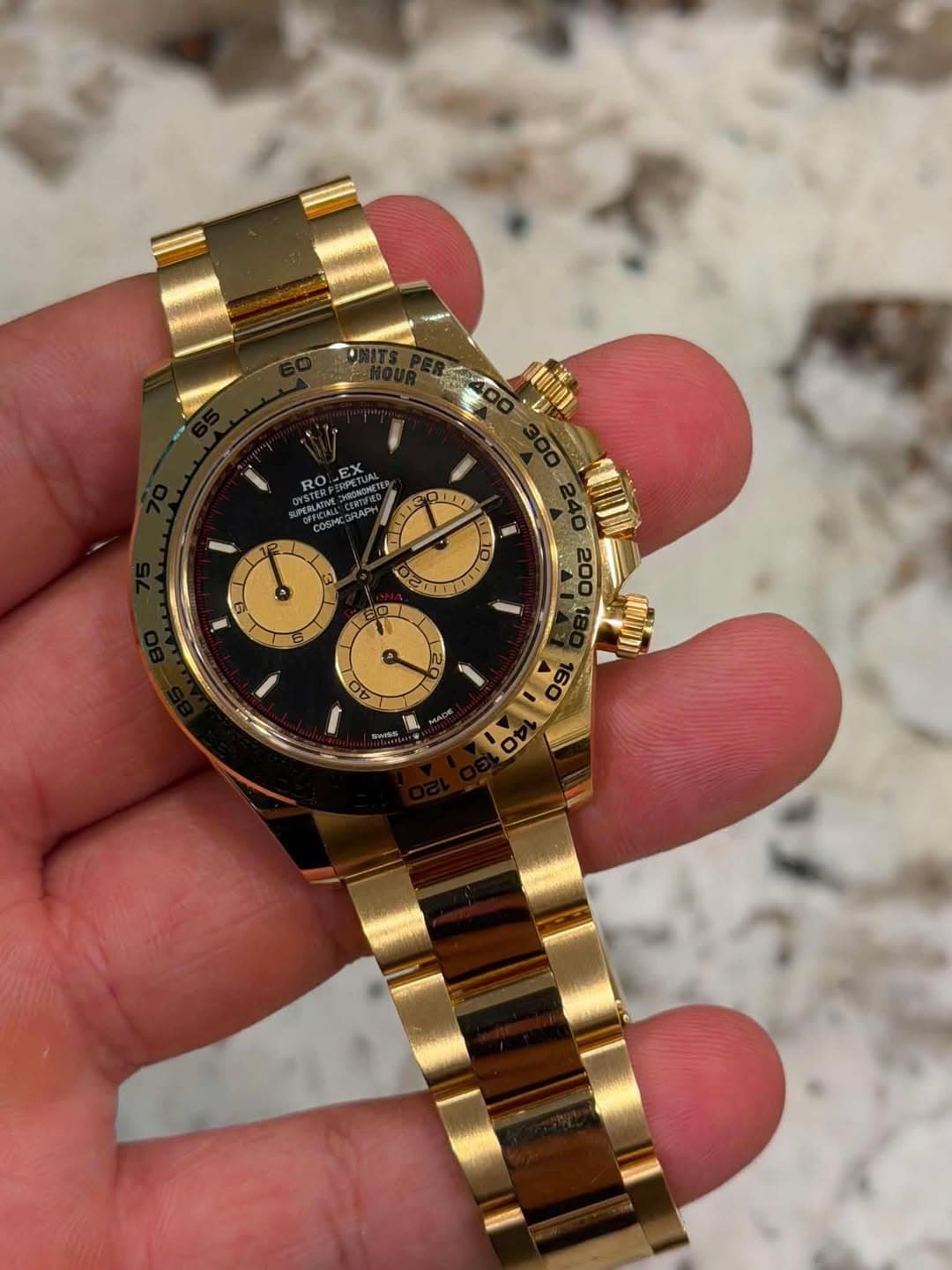 May be an image of wrist watch and text